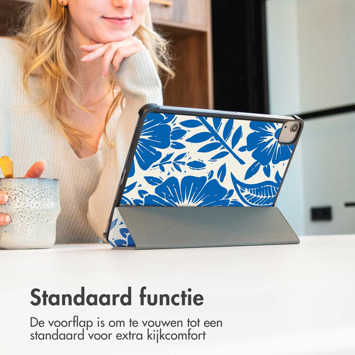 A woman with a tablet in a floral case. Text reads: Stand function.