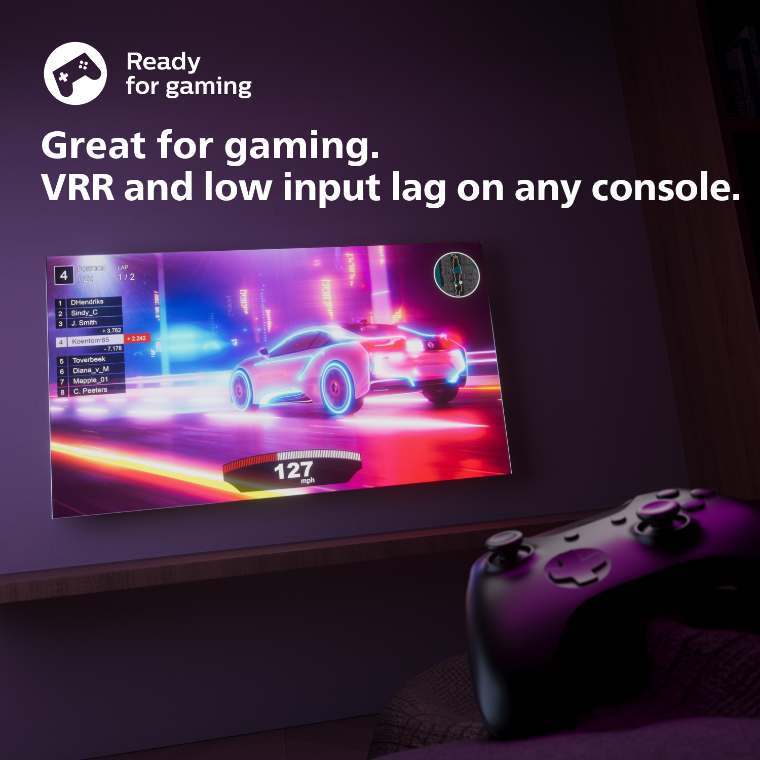 Una pantalla de TV con un juego de carreras, un controlador en primer plano. El texto dice 'Great for gaming'.