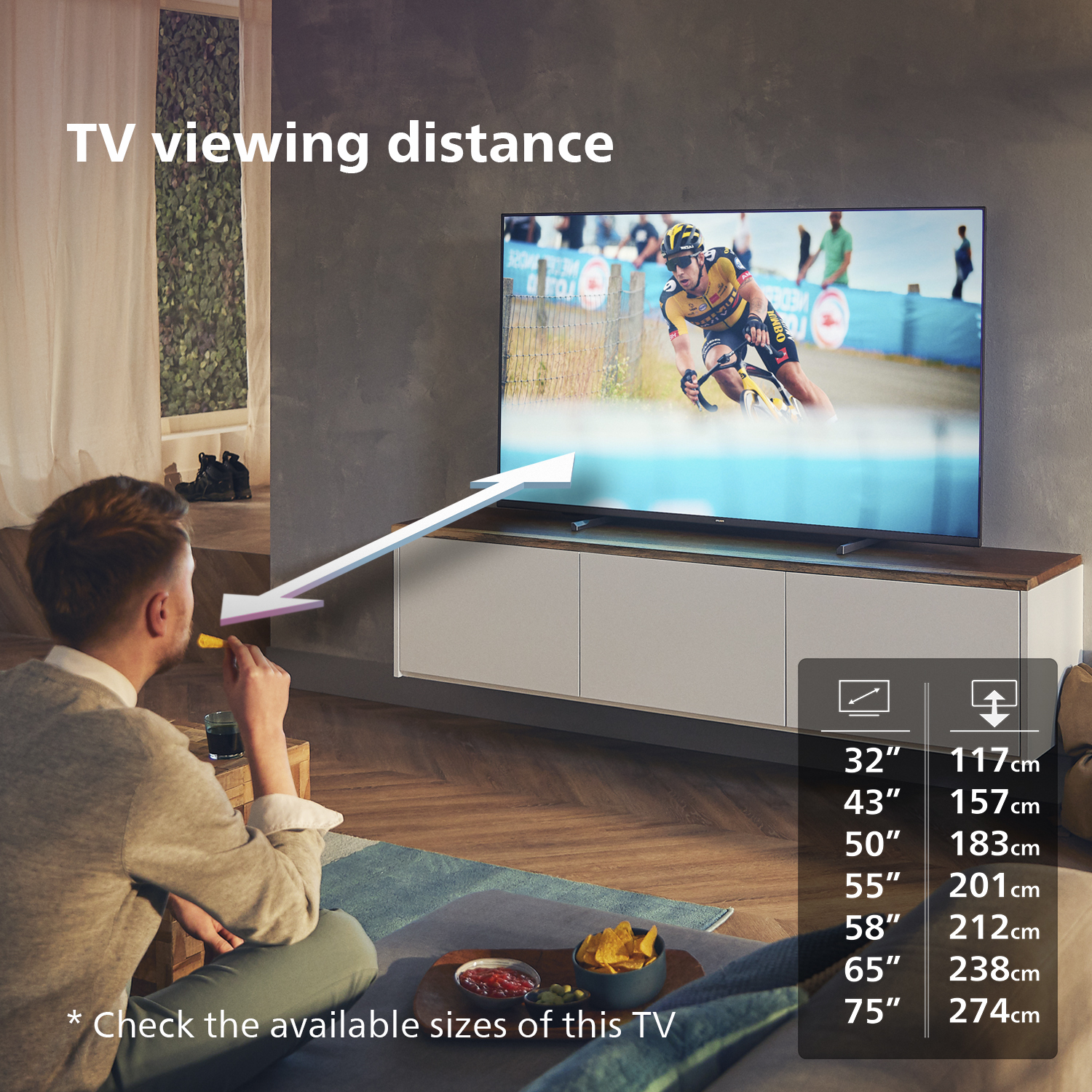 TV en un soporte, hombre mirando el TV, texto: Distancia de visualización del TV.