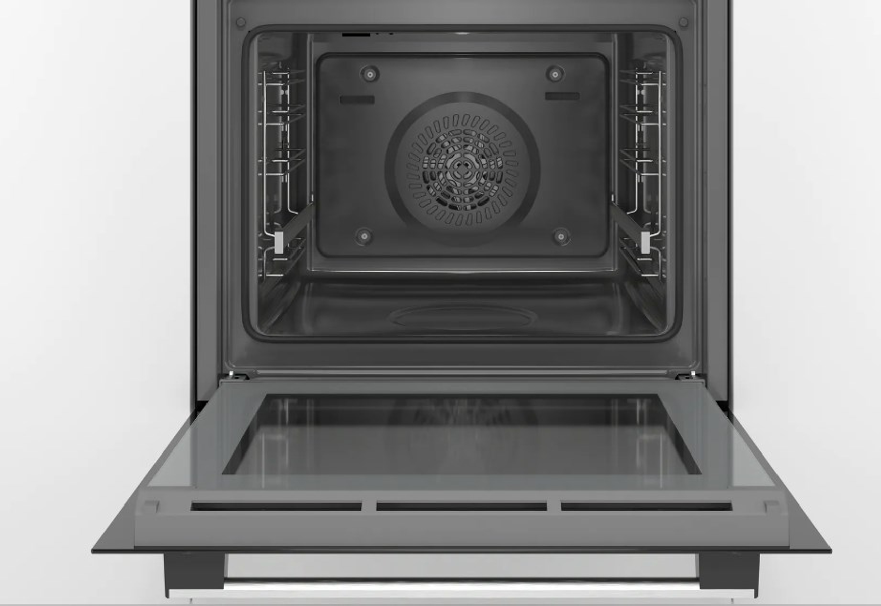 Horno abierto. Puerta de vidrio. Ventilador atrás. Interior acero inoxidable. Fondo blanco.