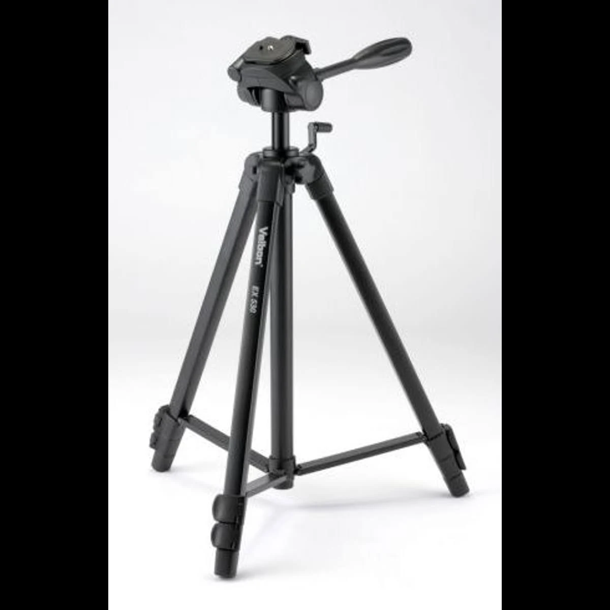 A black Velbon EX 550 tripod is on a white surface. It is fully extended.