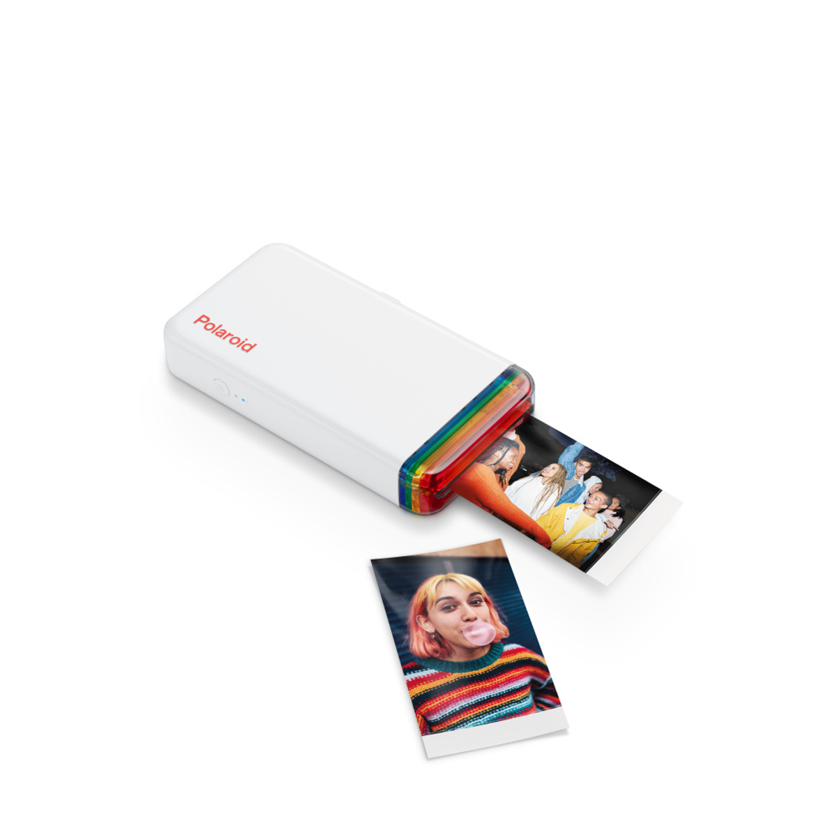 Weißer Polaroid-Drucker mit zwei gedruckten Fotos. Ein Foto zeigt eine Person, die einen Kaugummi bläst.