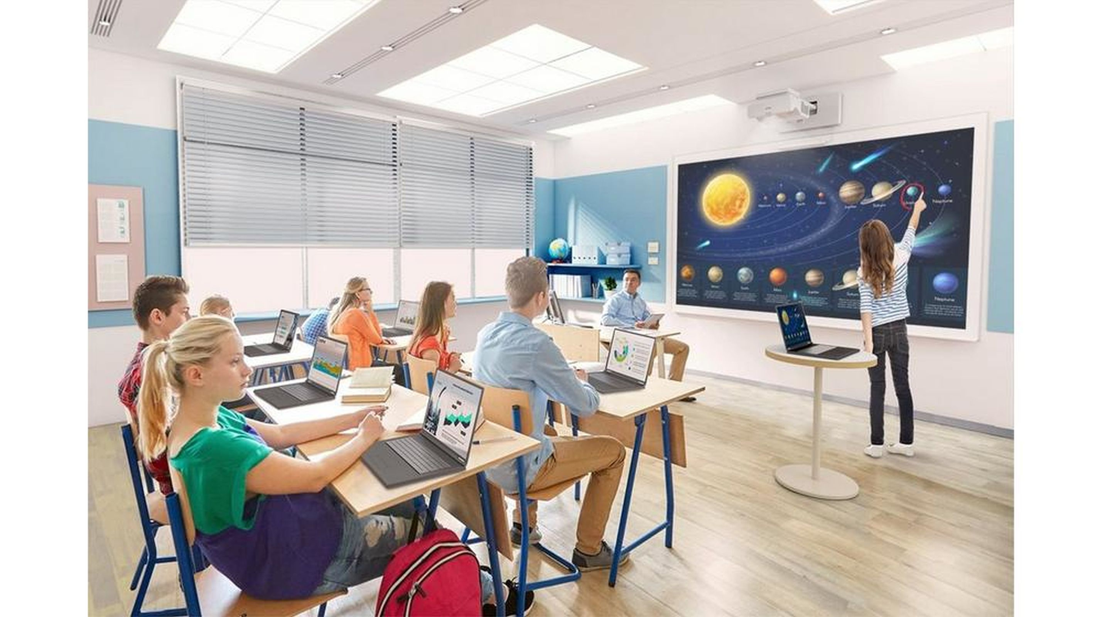 Scena w klasie z uczniami, nauczycielem i wyświetlaczem układu słonecznego.
