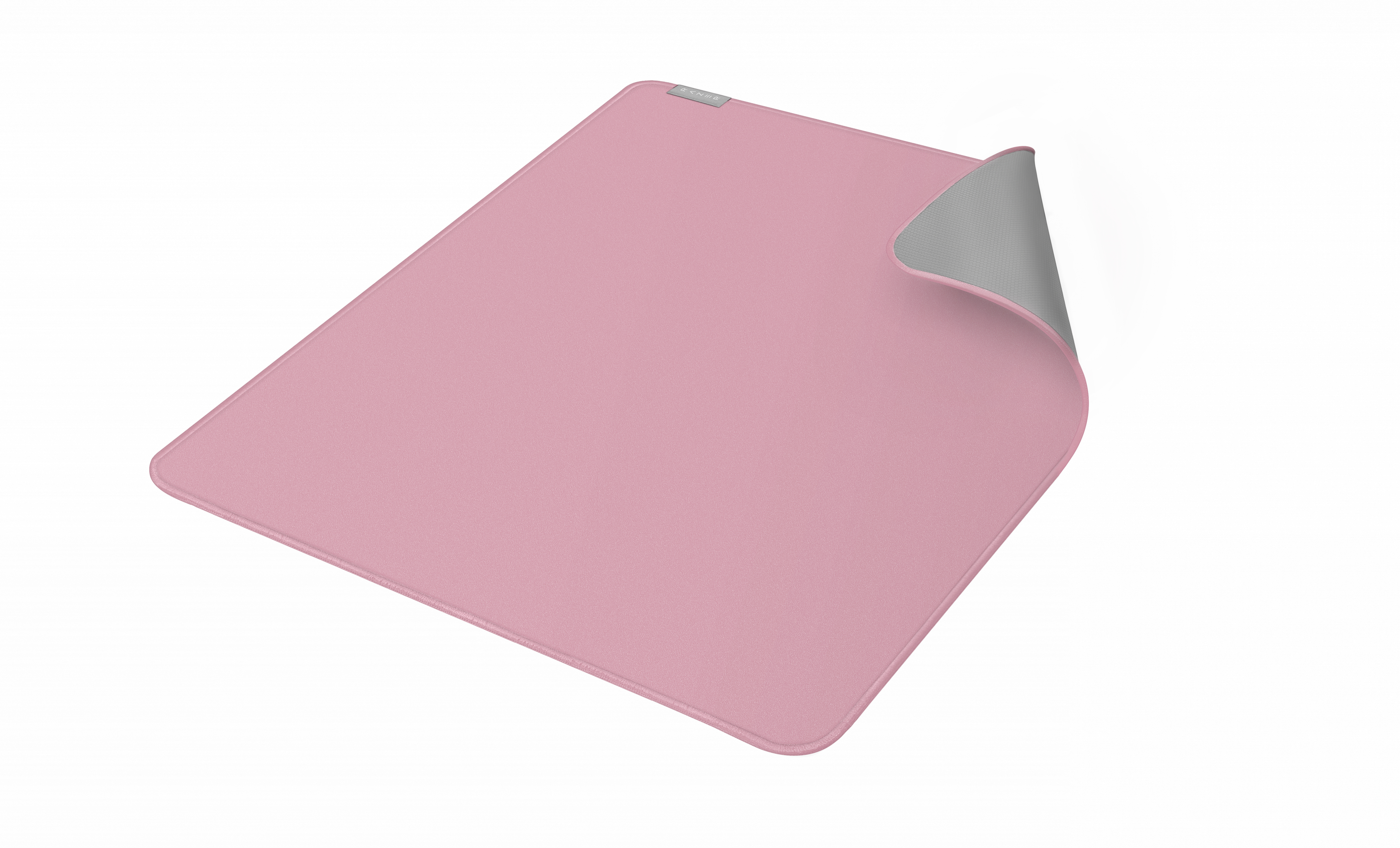 Ein rosa Mauspad. Die Unterseite ist grau. Das Pad ist leicht gekrümmt.
