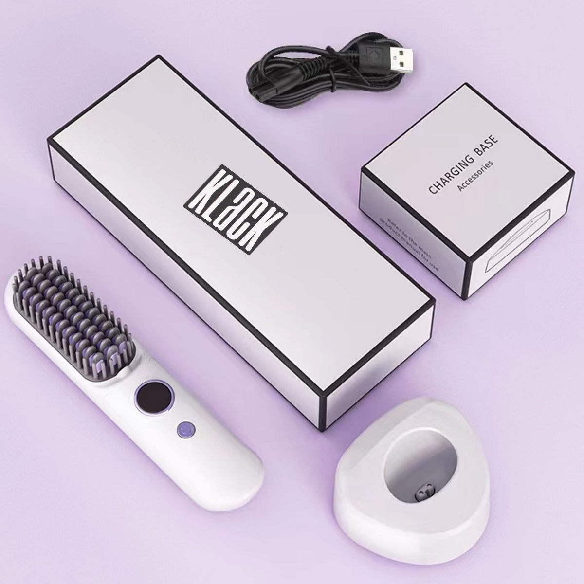 Un cepillo alisador blanco, base de carga y accesorios en una caja.