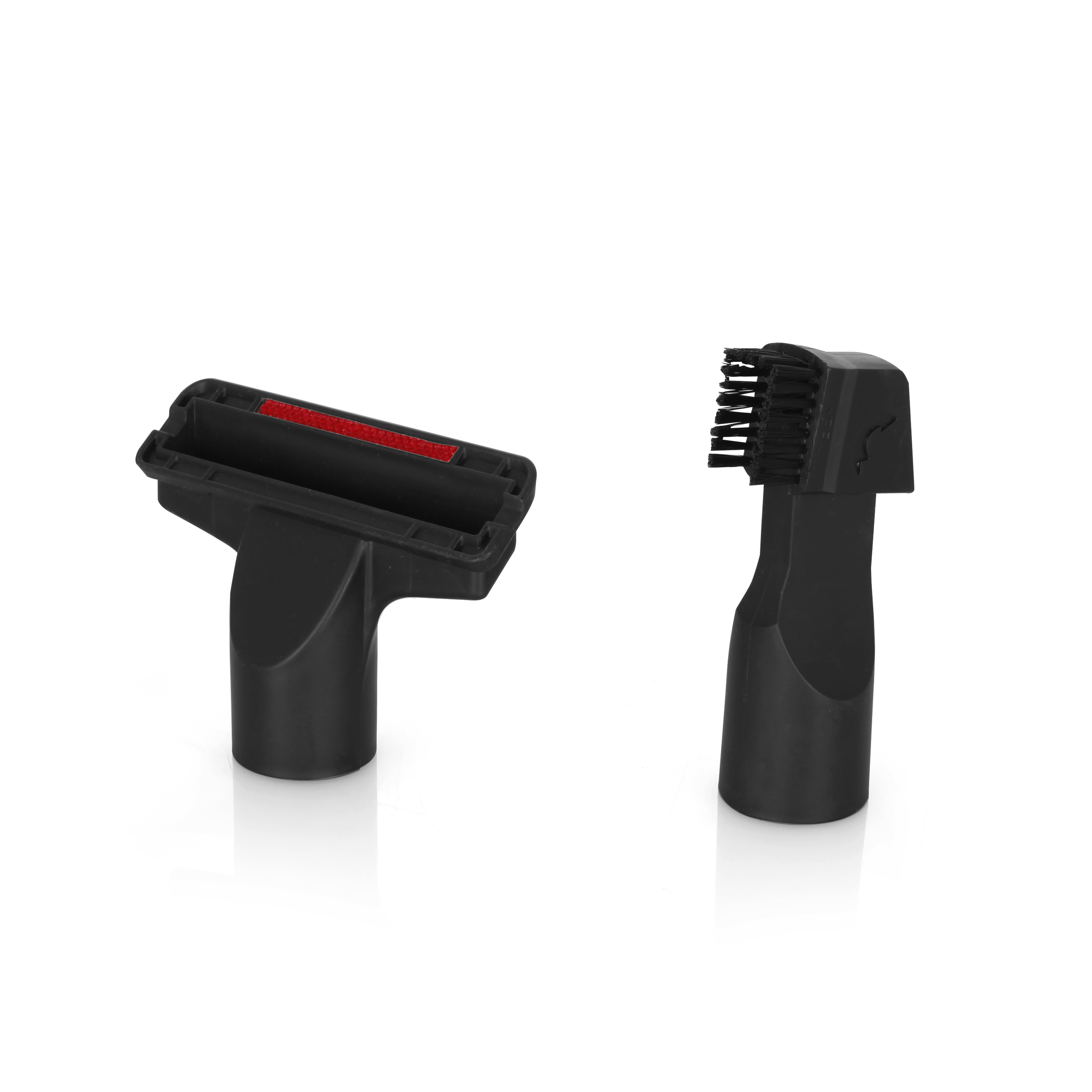 Dwie czarne końcówki do odkurzacza. Jedna to szczotka, druga to ssawka szczelinowa z czerwonym detalem.