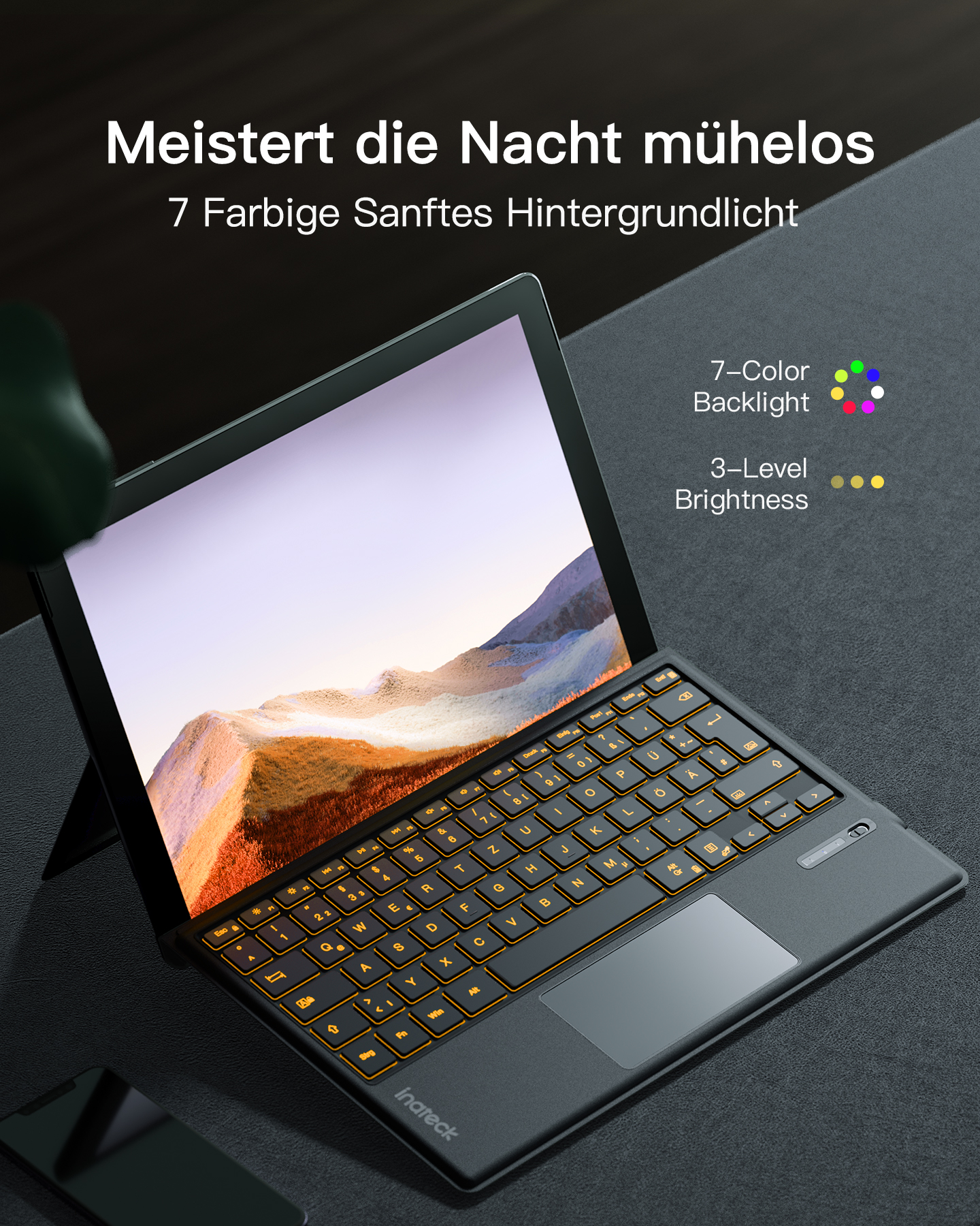 Schwarzes Tablet mit Tastatur. Die Tastatur ist mit orangefarbenem Licht beleuchtet.