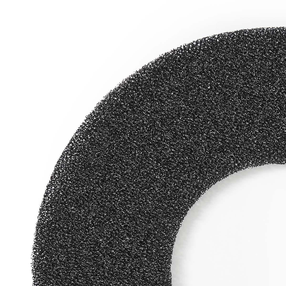 Close-up of a black, textured foam filter, with an arced shape against a white background.