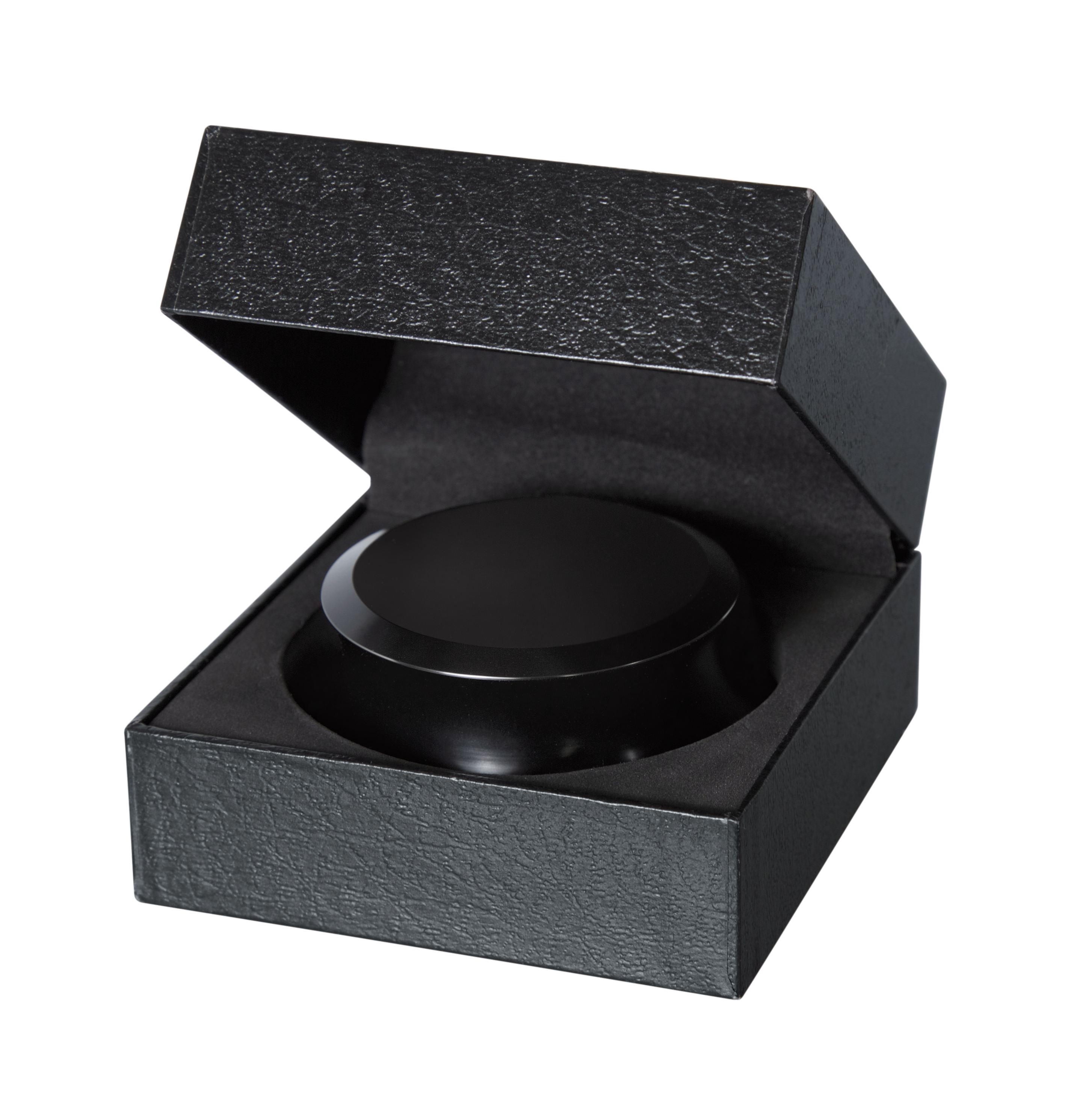 Schwarze Box mit einem kreisförmigen schwarzen Objekt darin. Die Box ist offen.