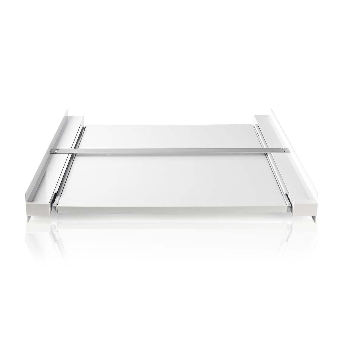 A white metal sliding tray on a white surface.