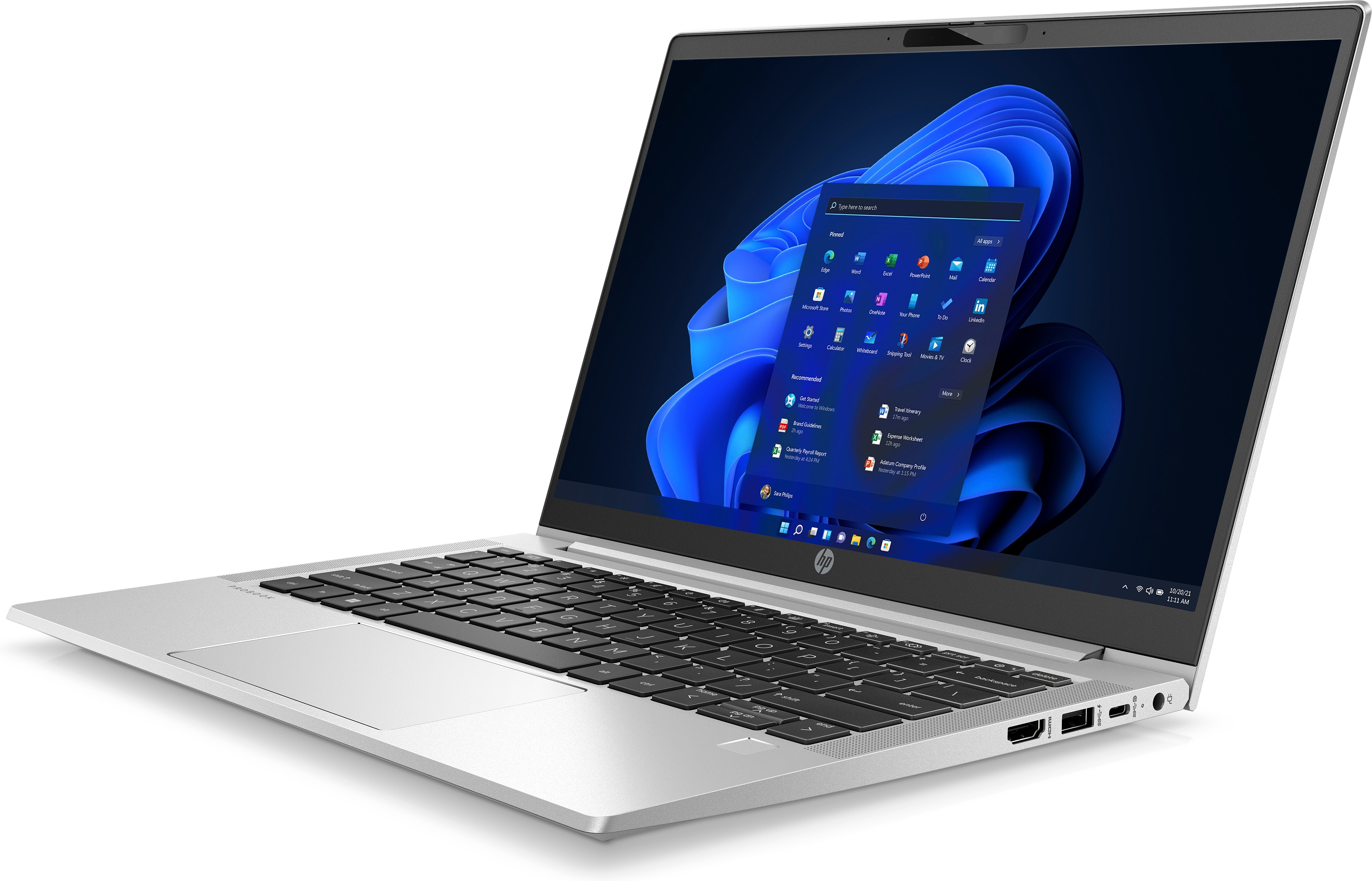 A silver HP laptop is open, showing a Windows 11 screen. The laptop is on a white surface.