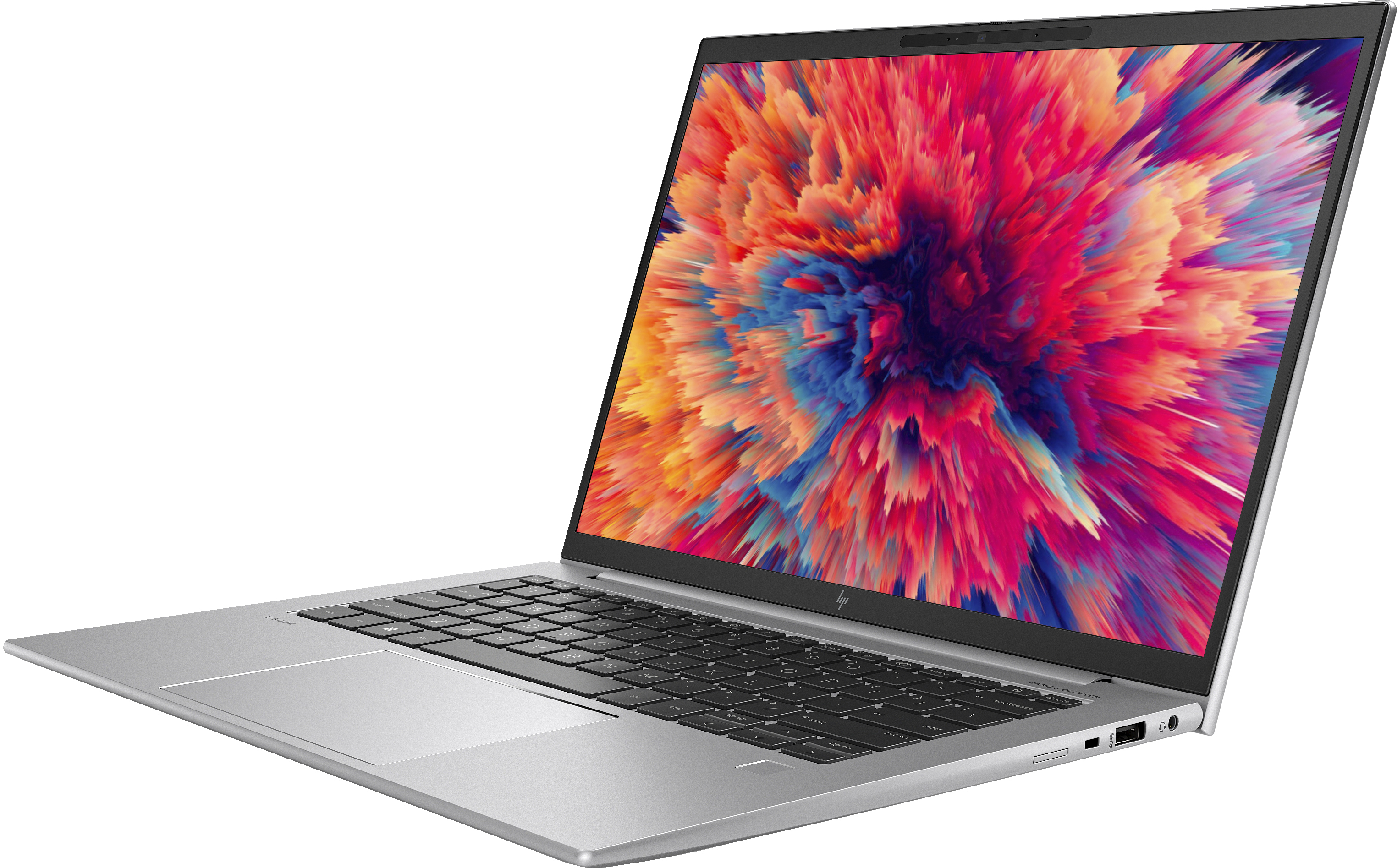 Un laptop argento con un design di esplosione vibrante e colorato sullo schermo.