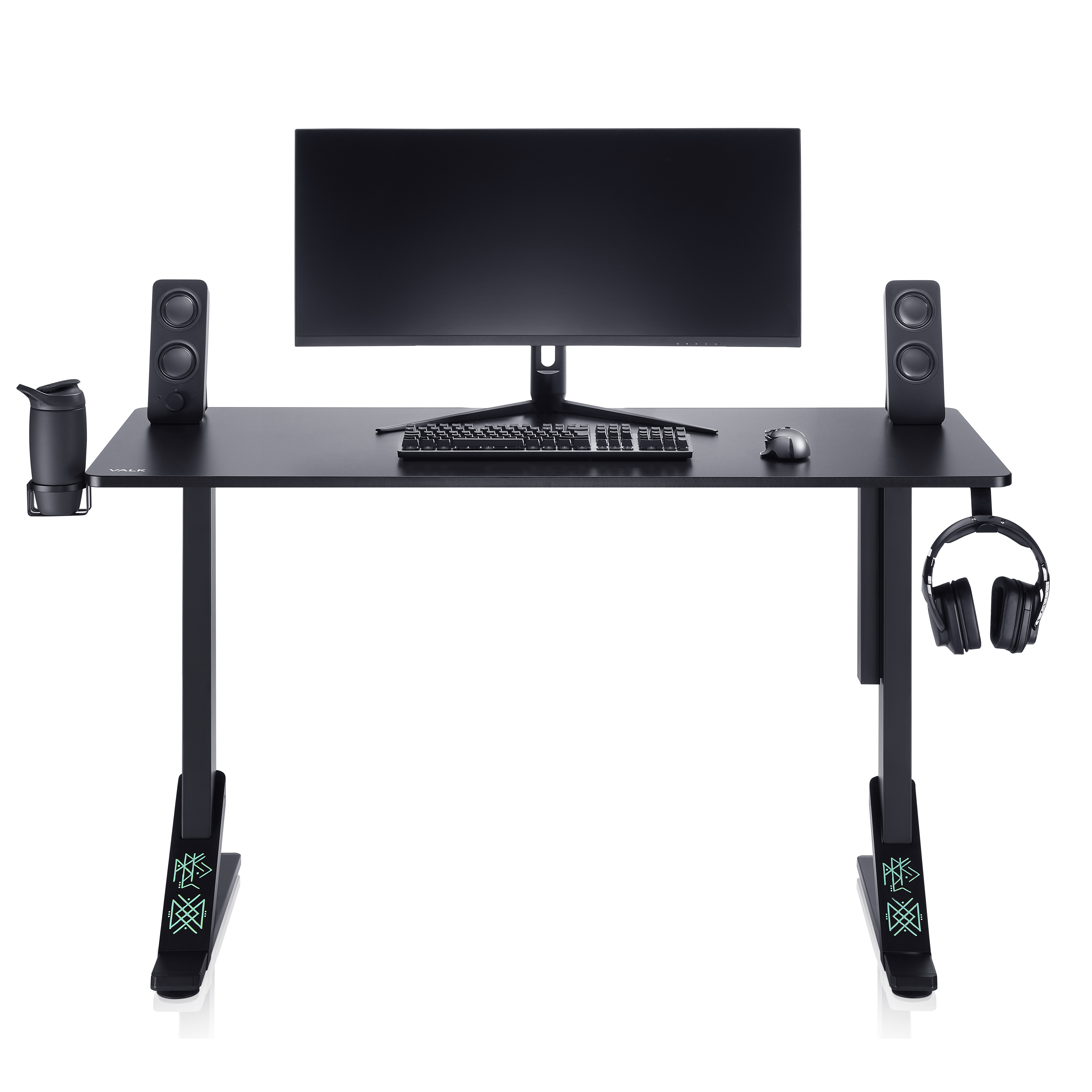 Un escritorio de juegos negro con monitor, altavoces, teclado y auriculares.