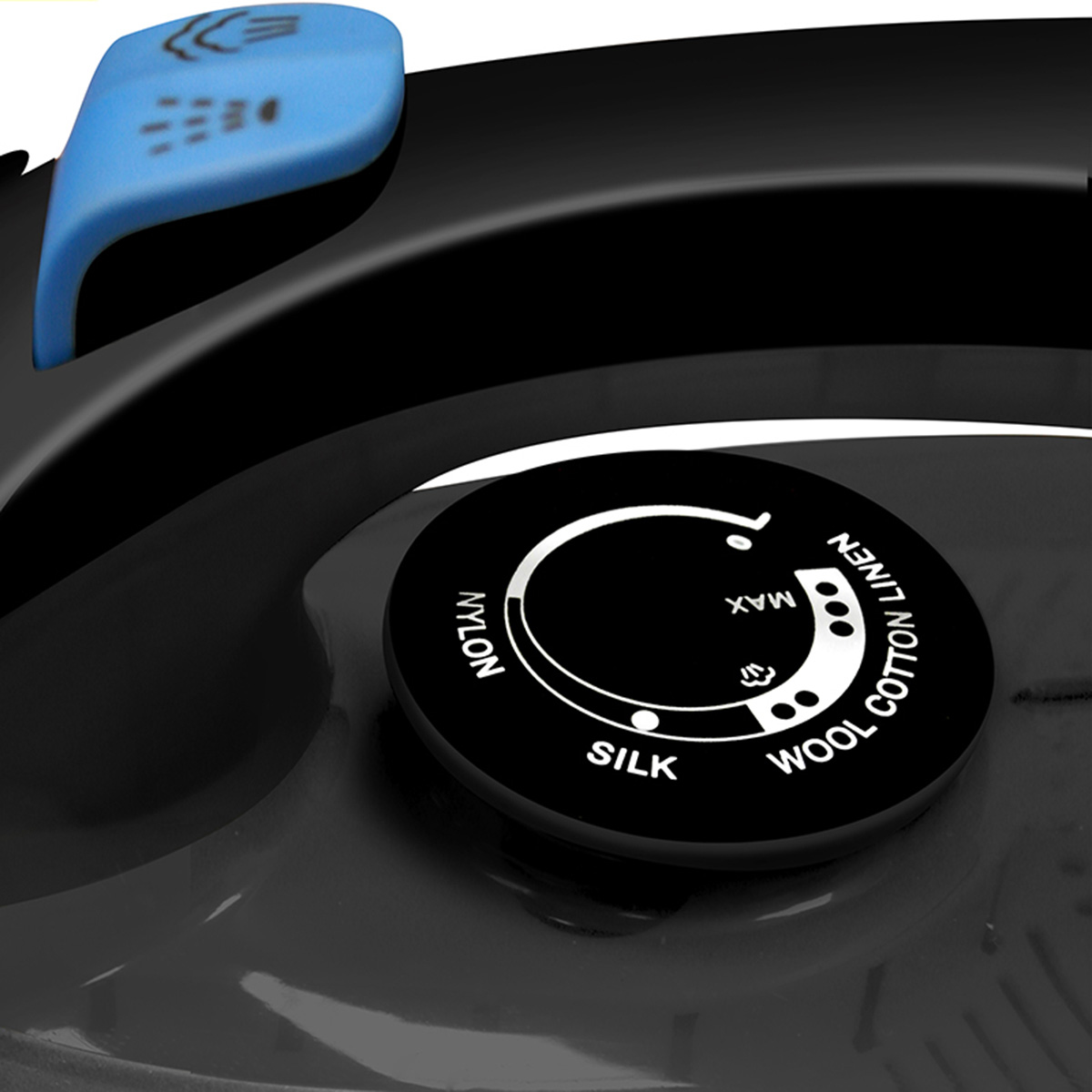 Primer plano del dial de una plancha. Los ajustes incluyen nailon, seda, lana, lino y max, sobre una superficie negra.