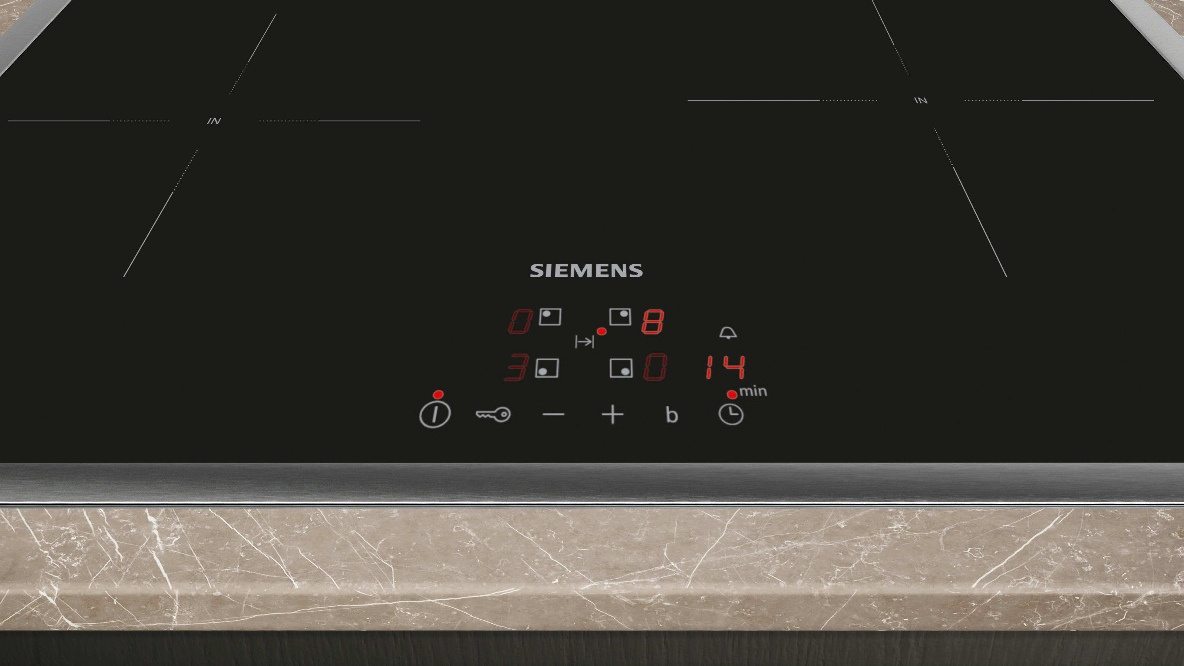 Piano cottura a induzione nero con display digitale rosso e comandi touch.