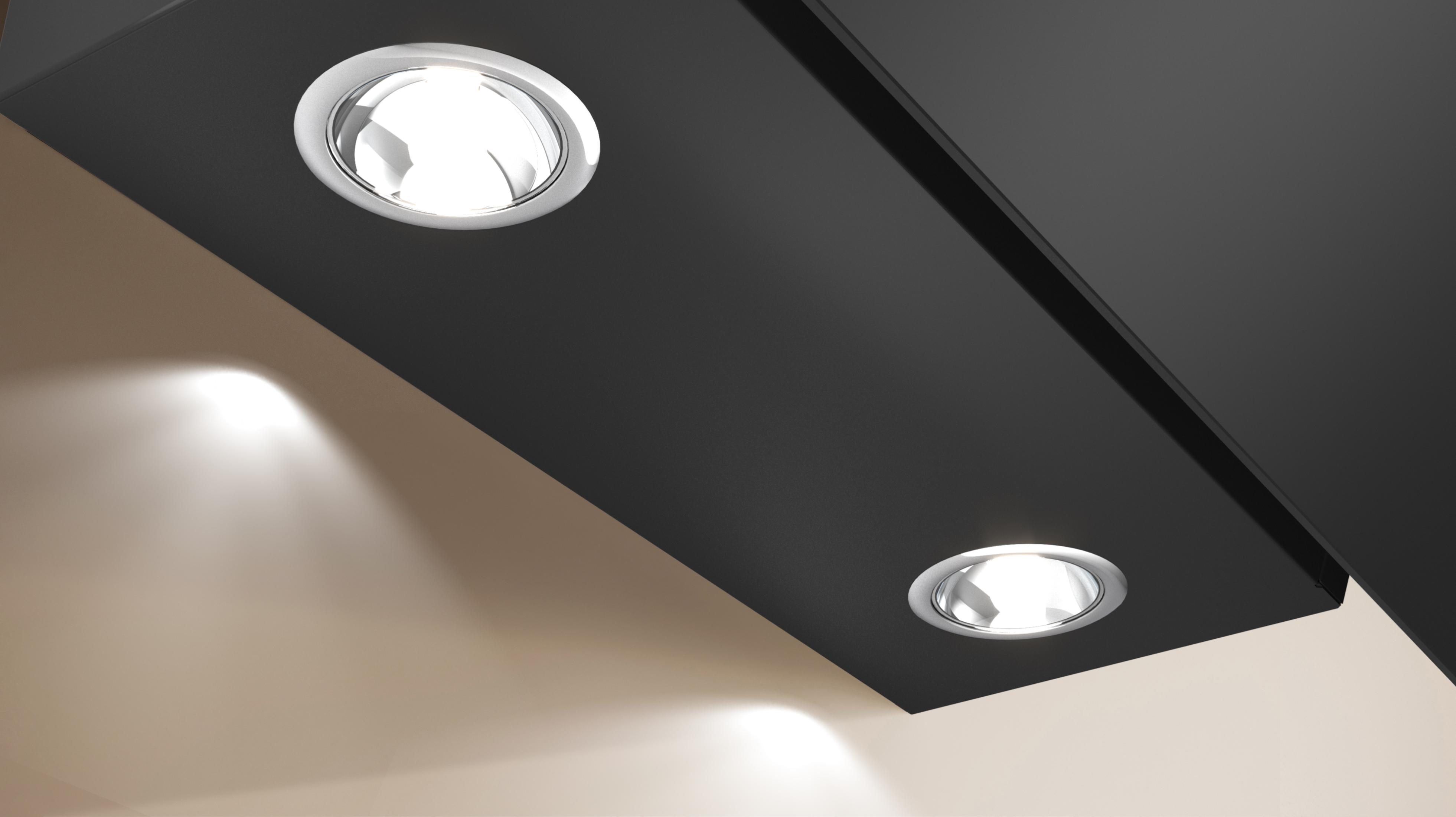 Primo piano di un soffitto nero con tre faretti a incasso.