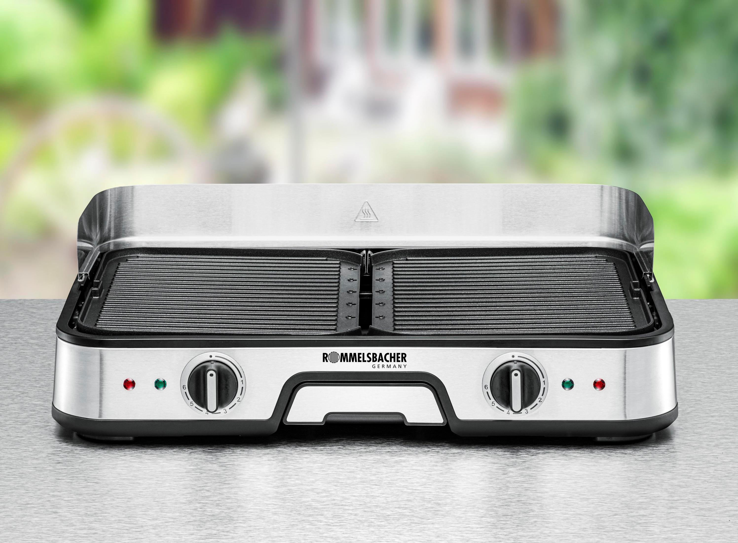 A silver and black electric grill with two cooking surfaces and temperature controls.