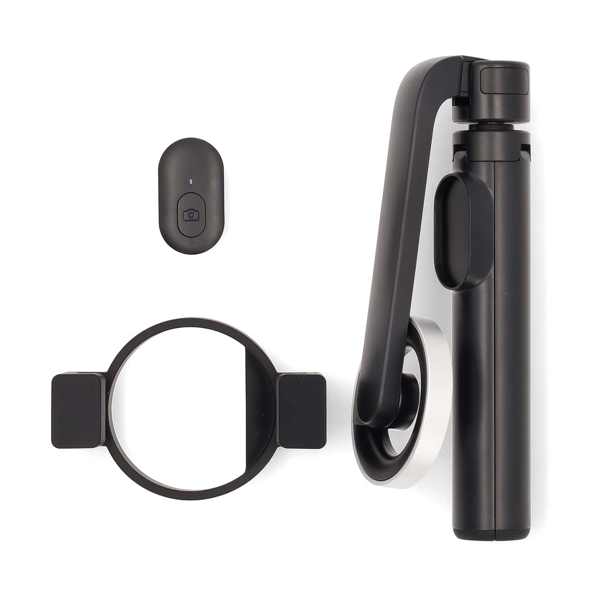 Ein schwarzer Selfie-Stick mit Fernbedienung, Telefonhalter und Ringlicht.