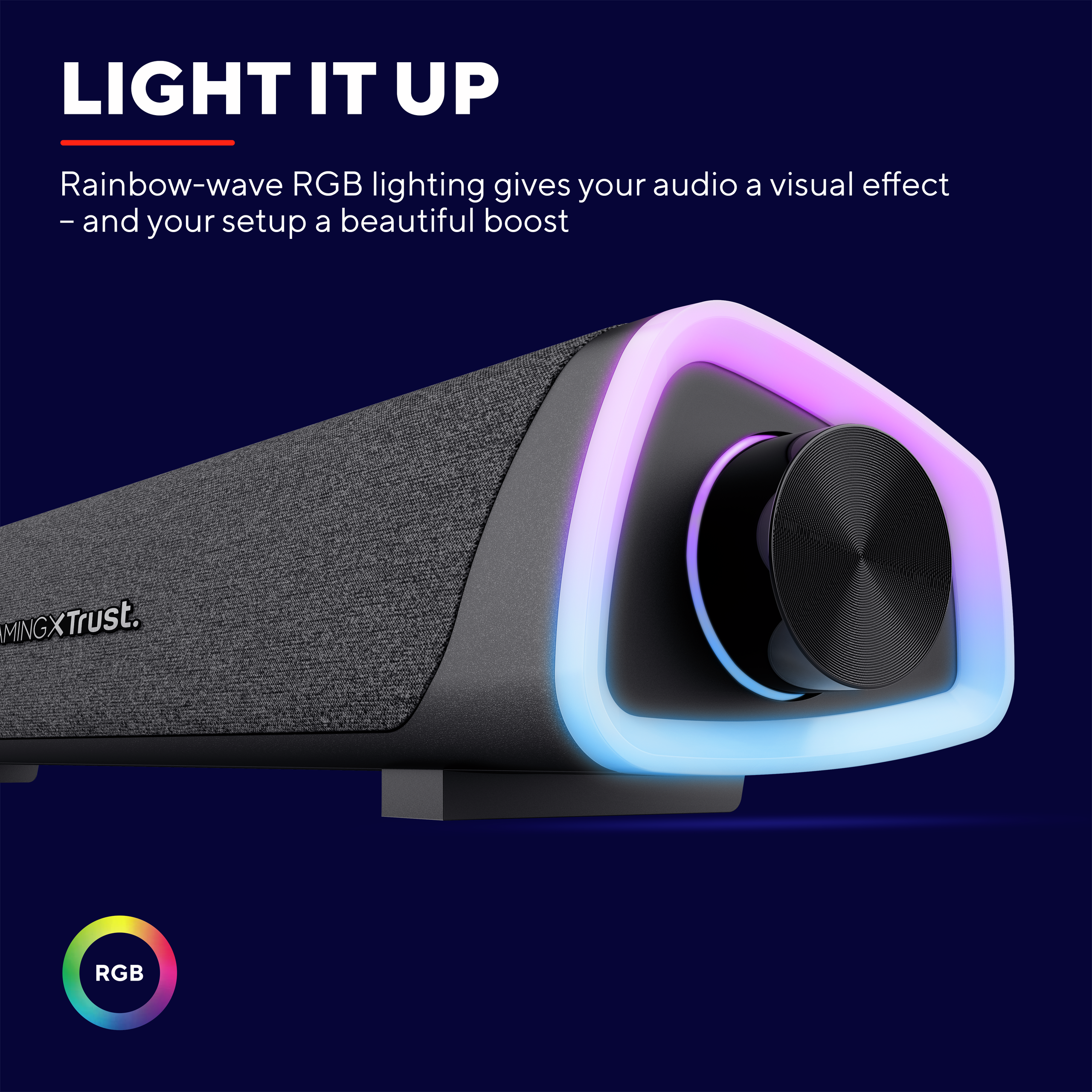 Czarny głośnik z podświetleniem RGB i regulacją głośności. U góry tekst 'LIGHT IT UP'.