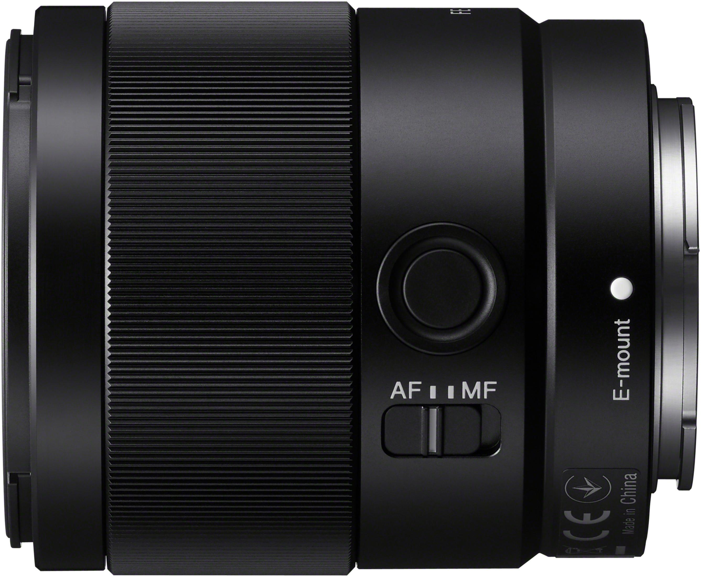 Black camera lens with adjustable focus settings.