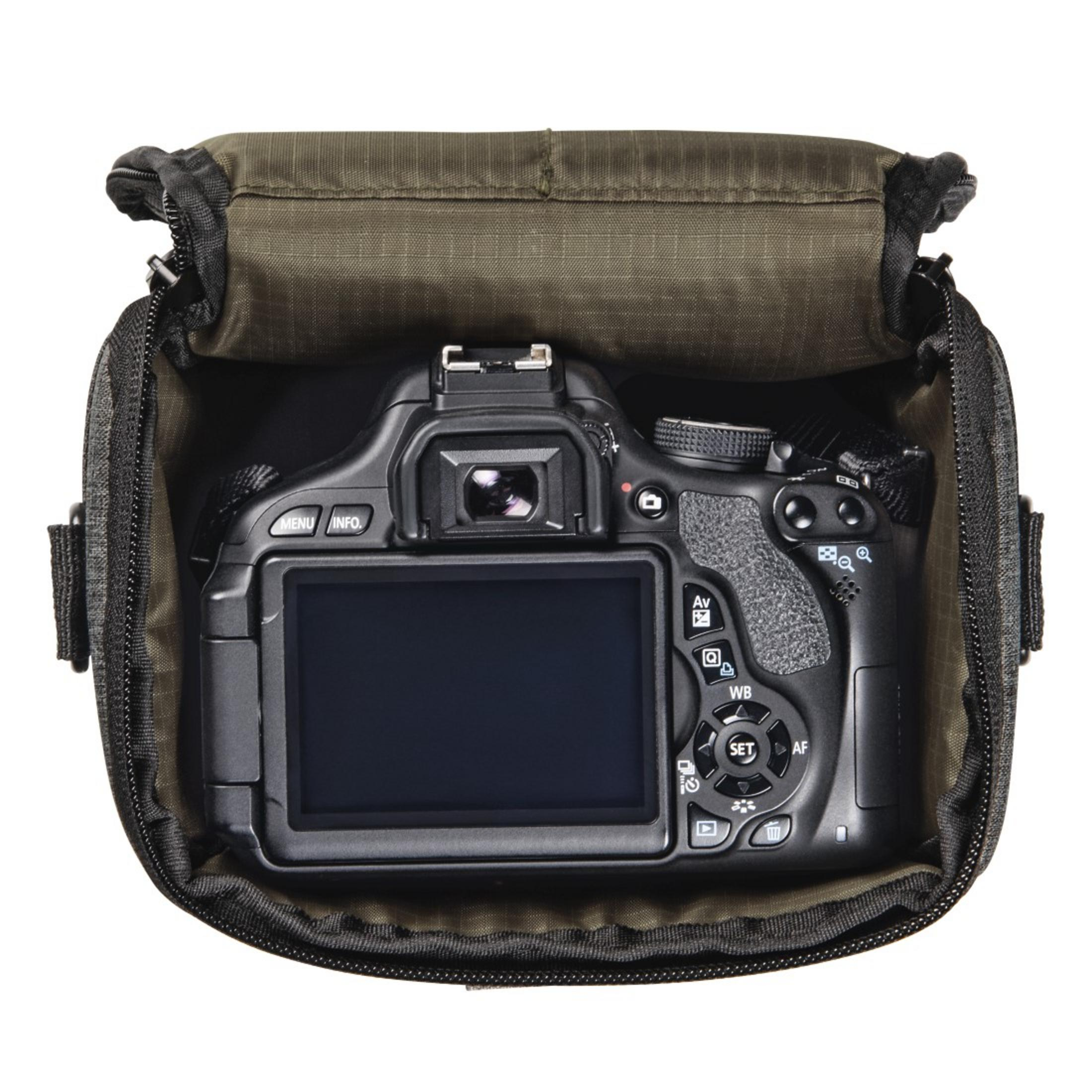 Camera inside a green bag, black camera screen facing forward.