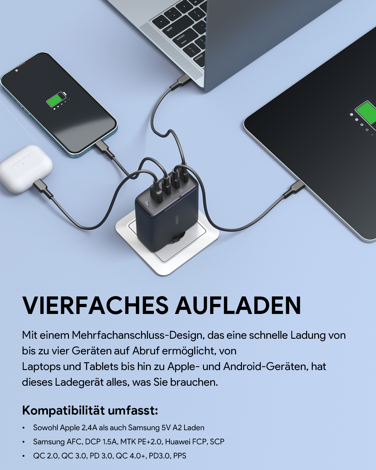 Schwarzer Ladehub mit mehreren Kabeln, die an Telefon, Laptop und andere Geräte angeschlossen sind.