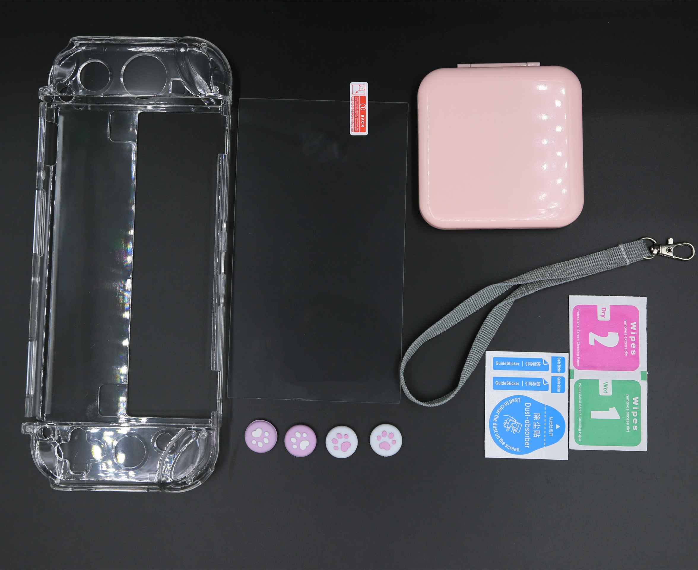 Contents of a gaming console accessory kit, including case, screen protector, and cleaning wipes.