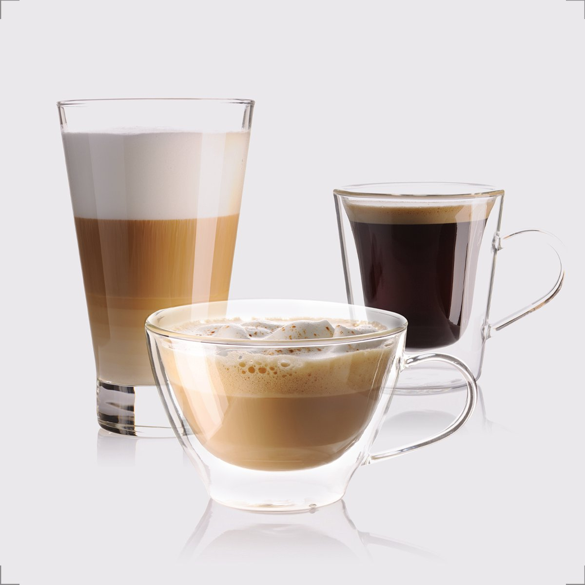 Three different coffee drinks in glasses. Latte, cappuccino, and black coffee. White background. 