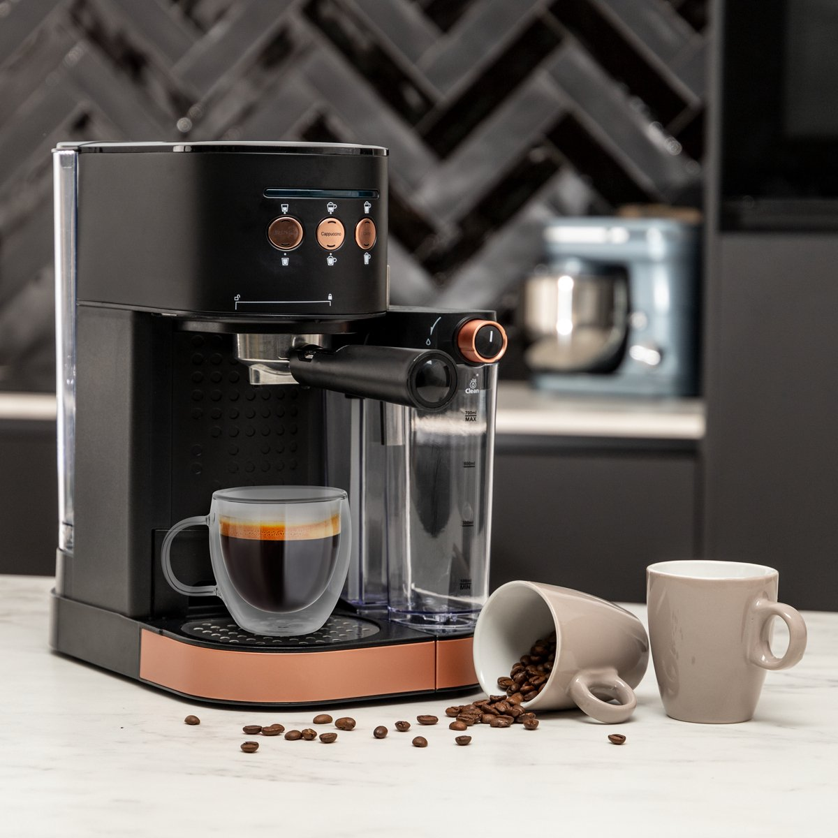 Black and copper espresso machine with a glass cup of coffee. Coffee beans spilled.