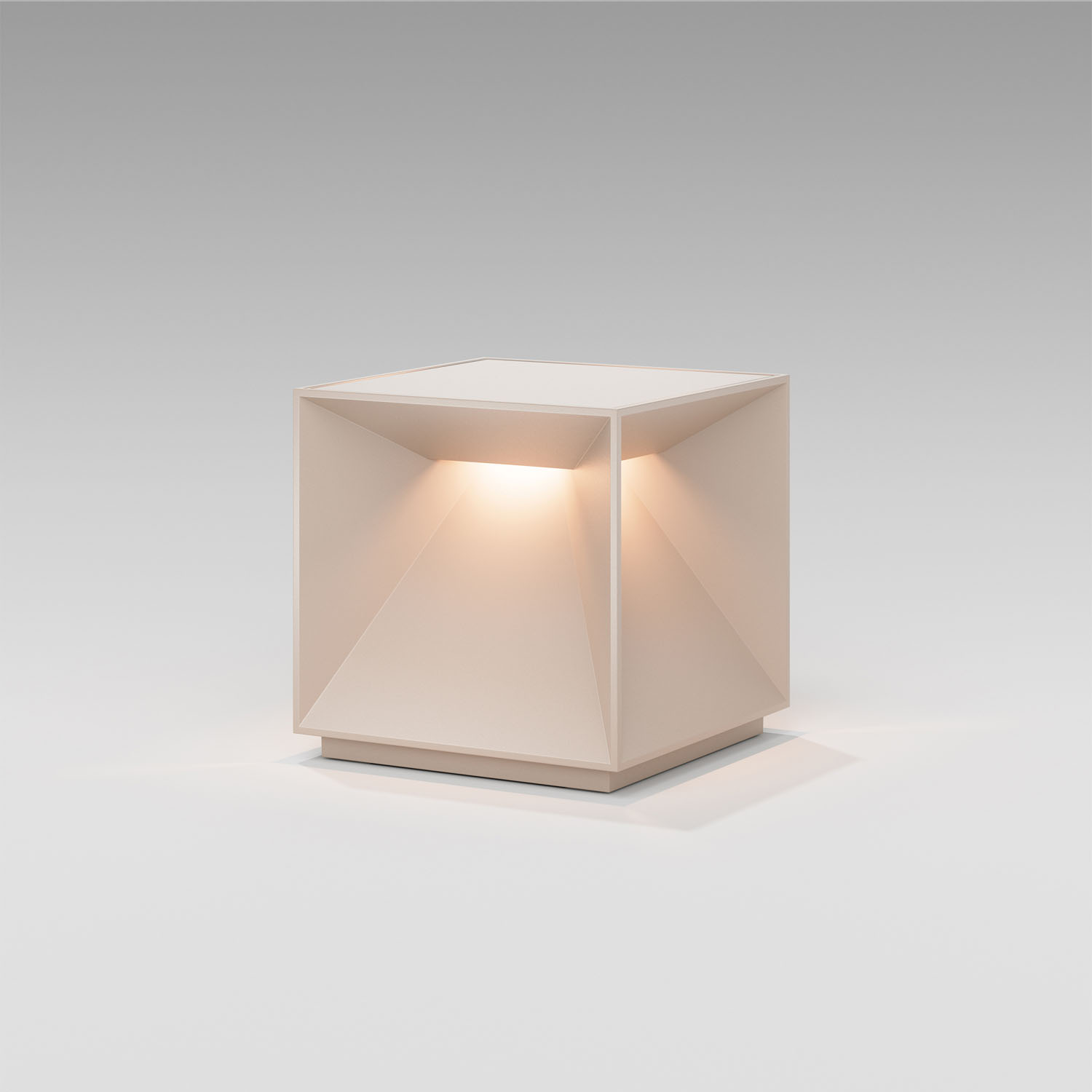 Beleuchtete würfelförmige Lampe mit geometrischem Design, die Licht von innen abstrahlt.