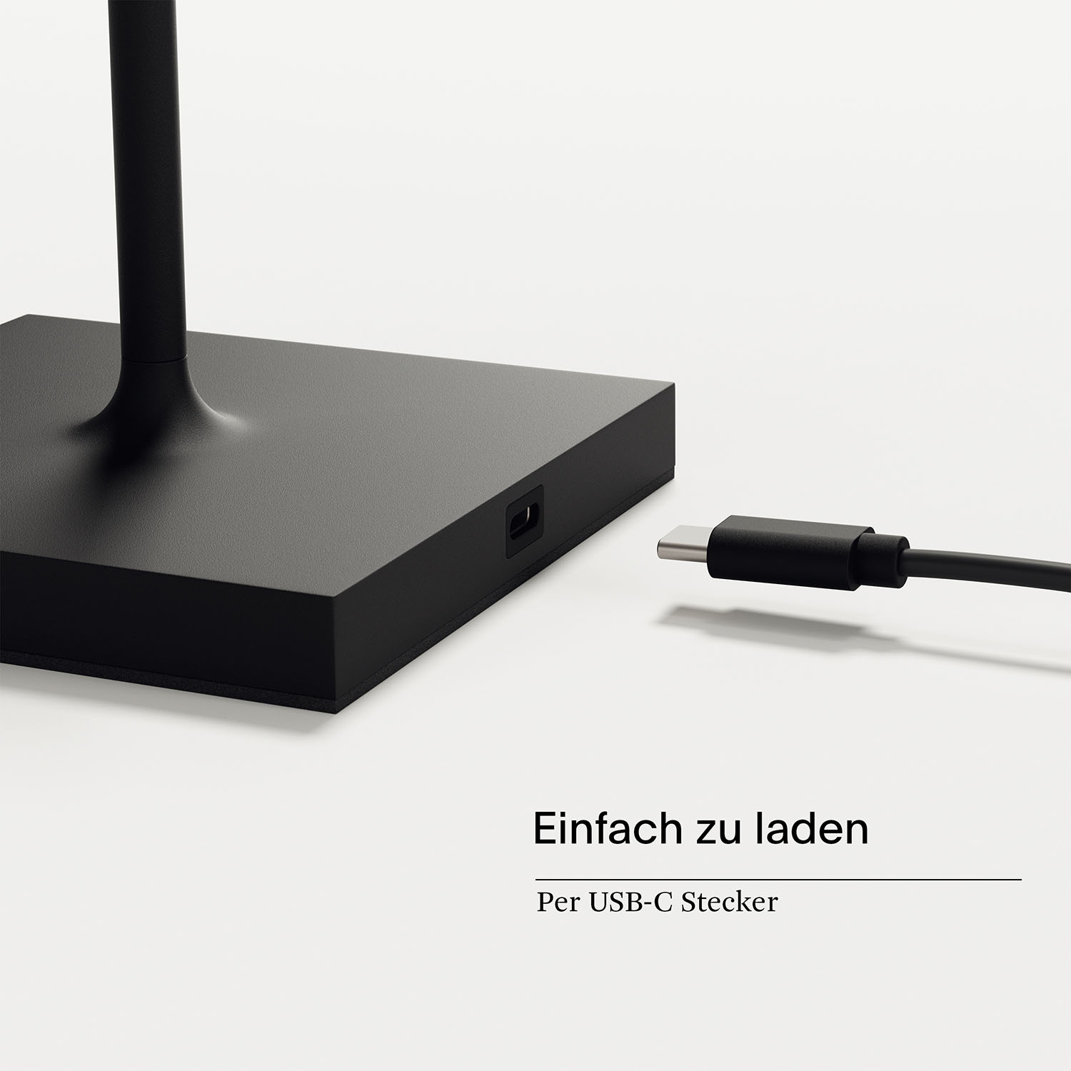 Base della lampada nera con porta USB-C e cavo collegato.