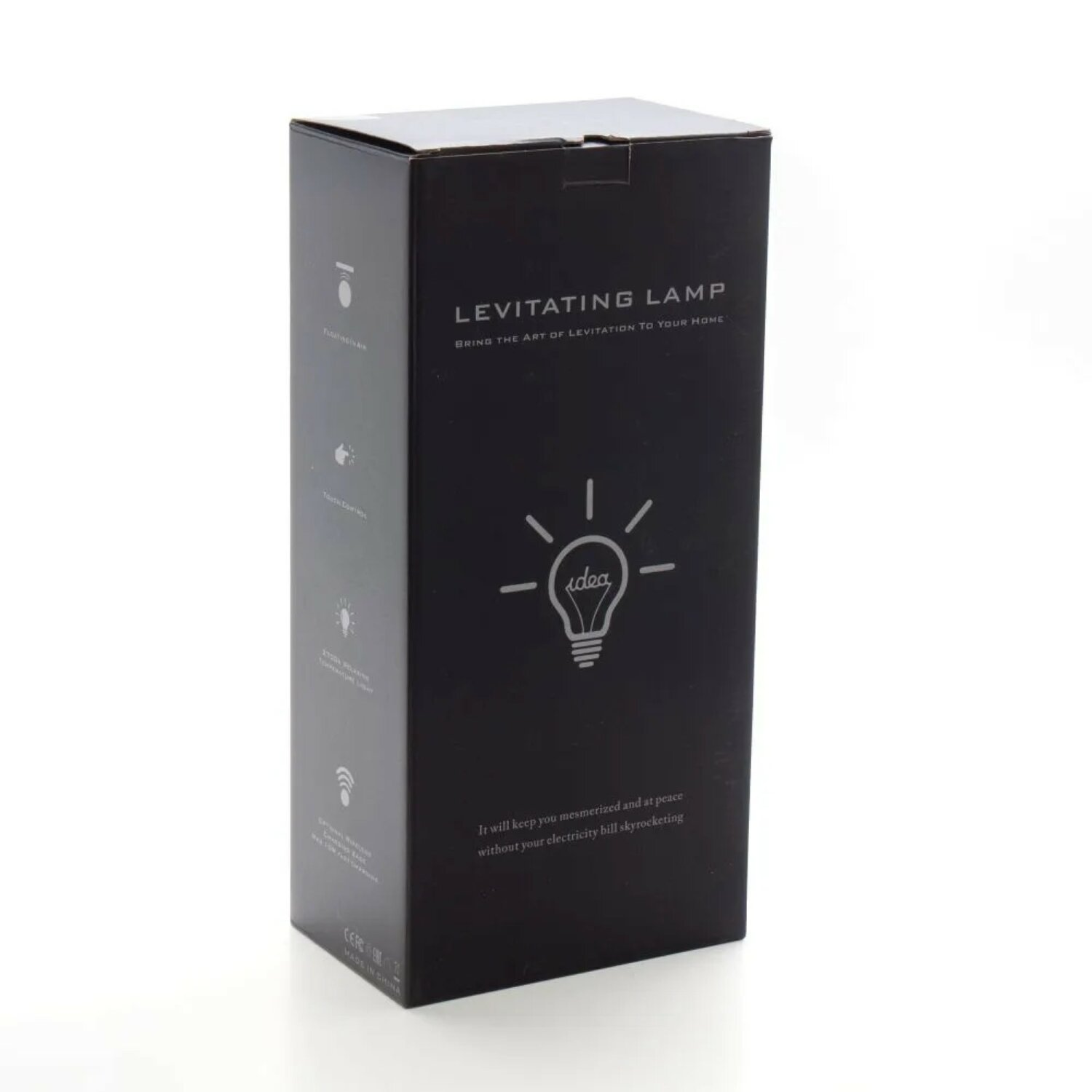 Schwarze Box mit der Aufschrift 'LEVITATING LAMP'. Sie hat das Bild einer Glühbirne und Text.
