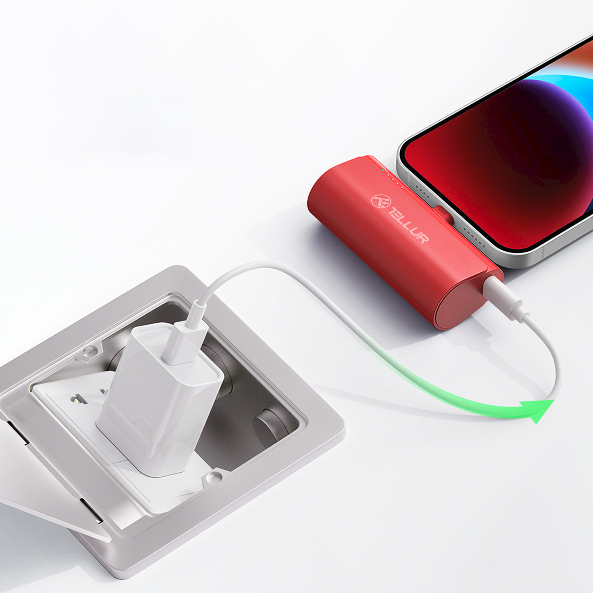Czerwony power bank ładujący telefon za pomocą białego kabla. Znajduje się w szarym gnieździe obok białej ładowarki.