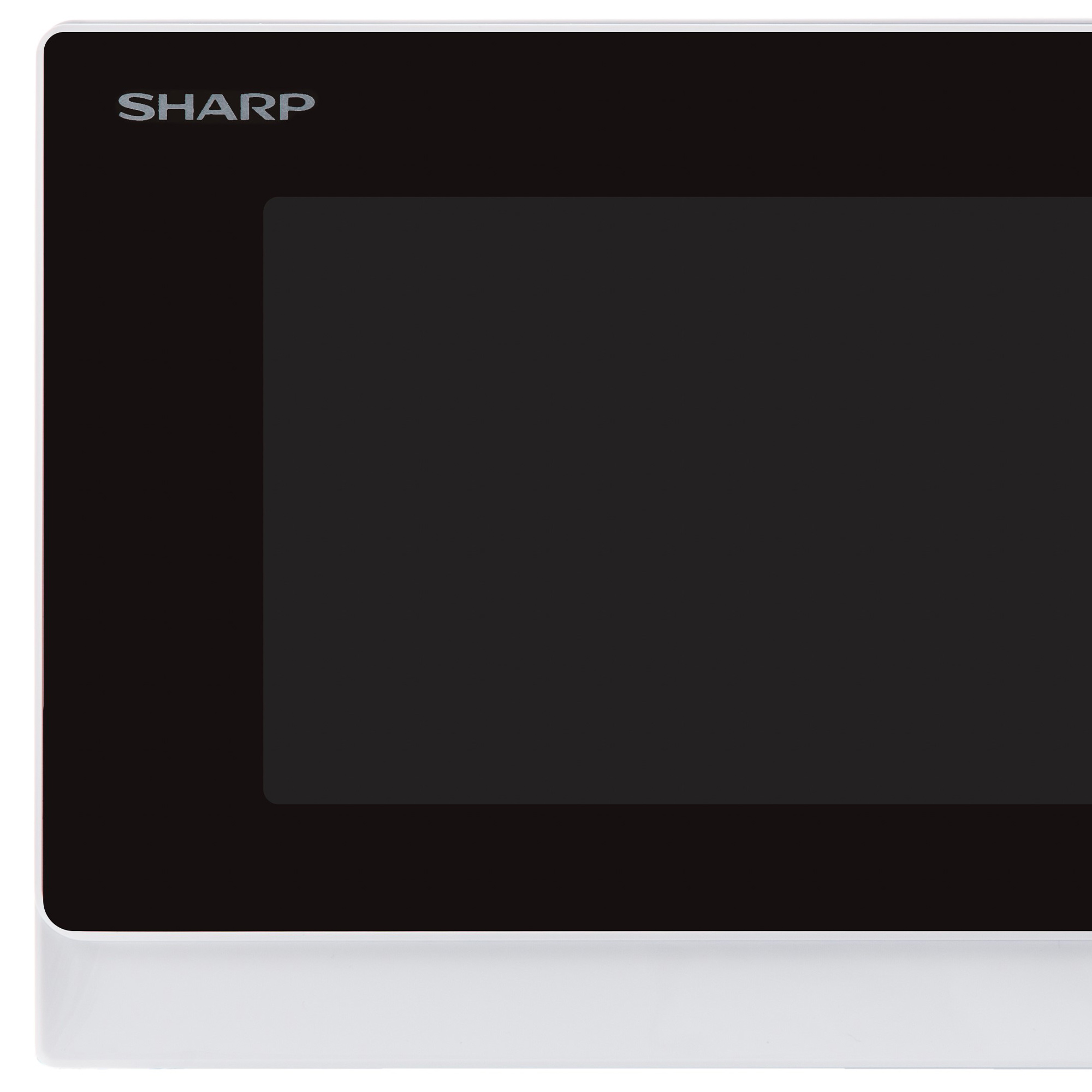 Una esquina de un horno microondas Sharp que muestra la pantalla negra y el marco blanco.
