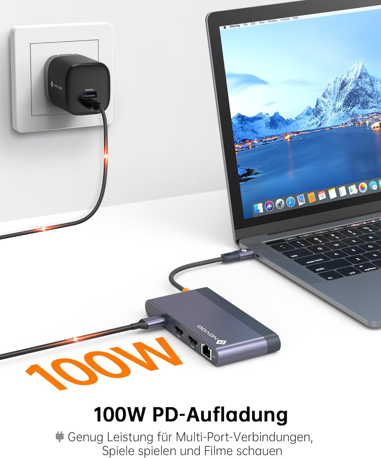 Laptop mit 100W Leistung geladen, an einen Hub angeschlossen, an der Wand.