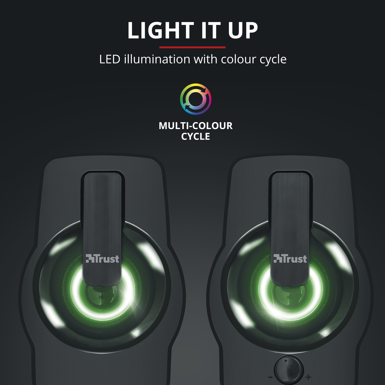 Two black speakers with green light in the center, and a text saying 'LIGHT IT UP'.
