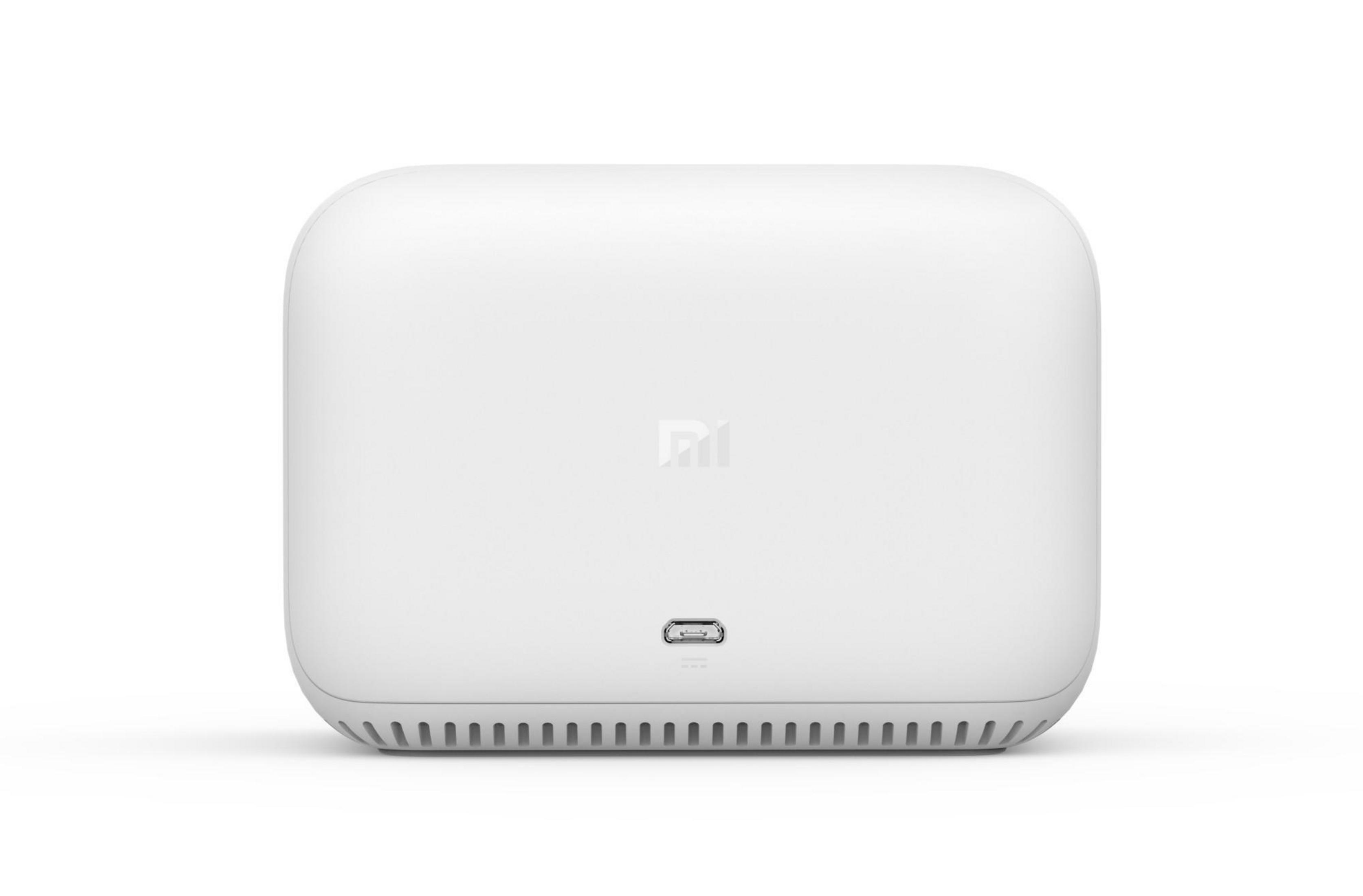 Ein weißer Router mit einem USB-Anschluss und dem MI-Logo.