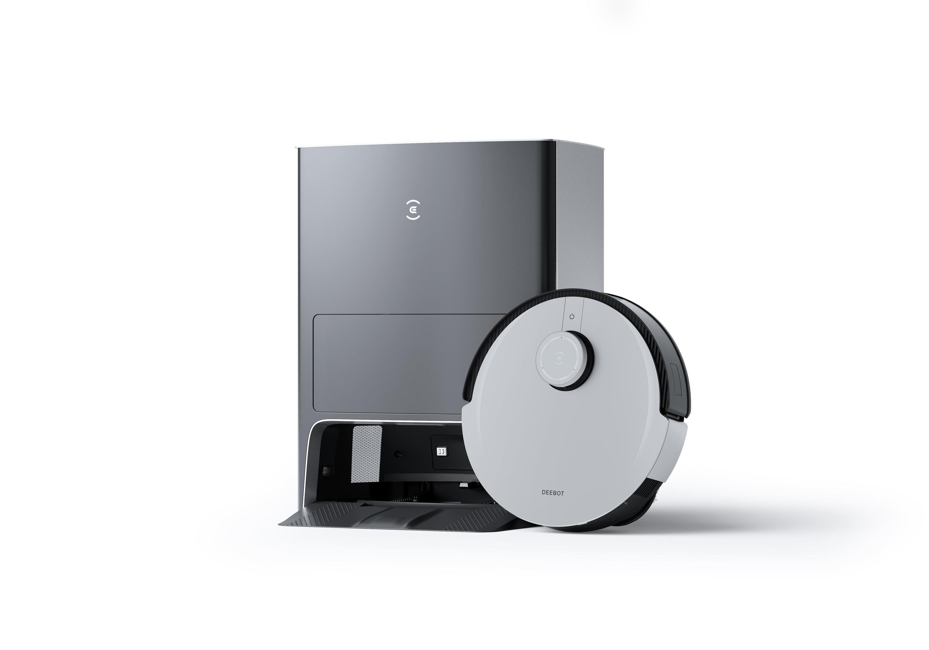 Roboter-Staubsauger und Ladestation, weiß und grau auf weißem Hintergrund.