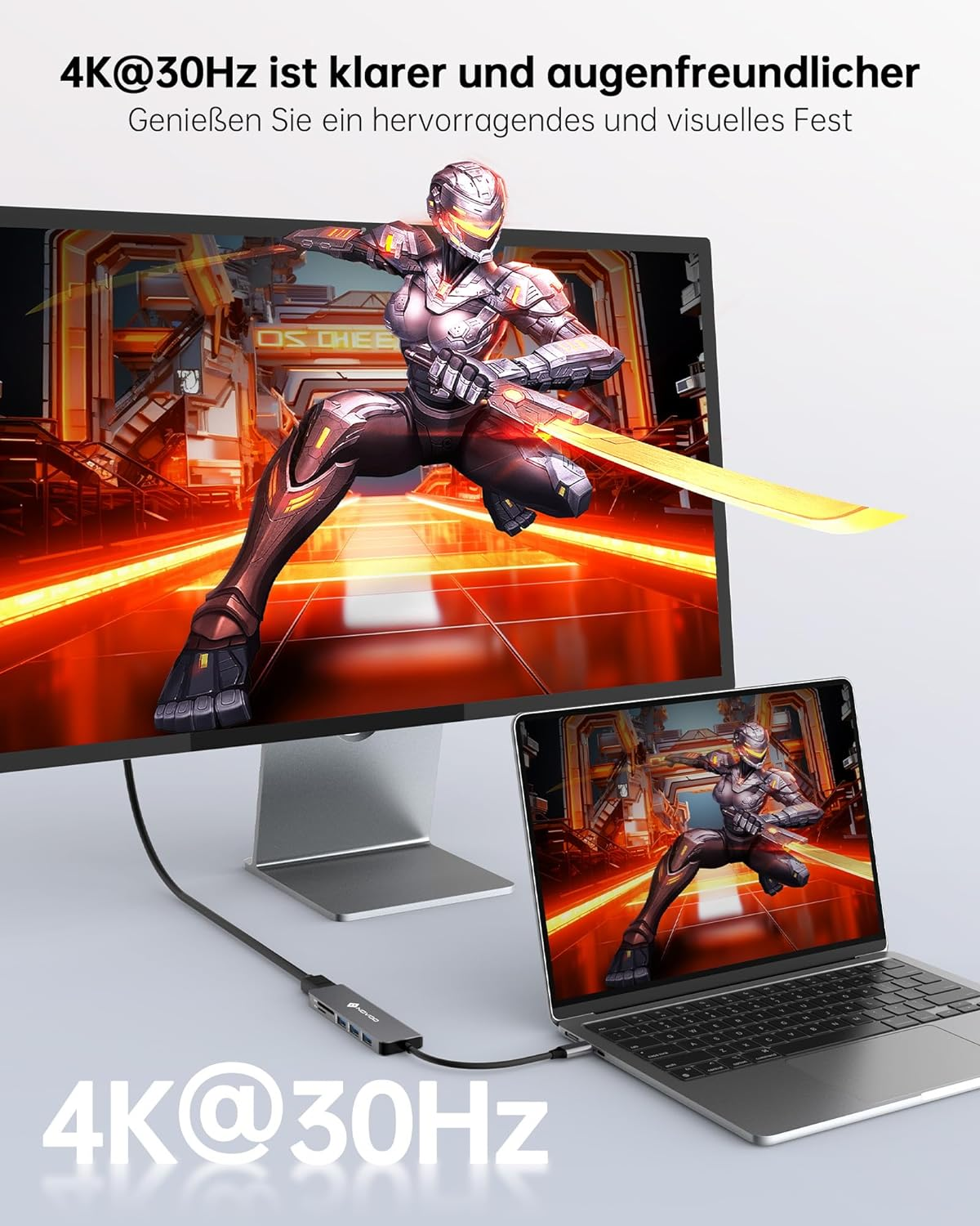 Ein Monitor und ein Laptop mit Verbindungskabel. Eine Person ist auf den Bildschirmen zu sehen.