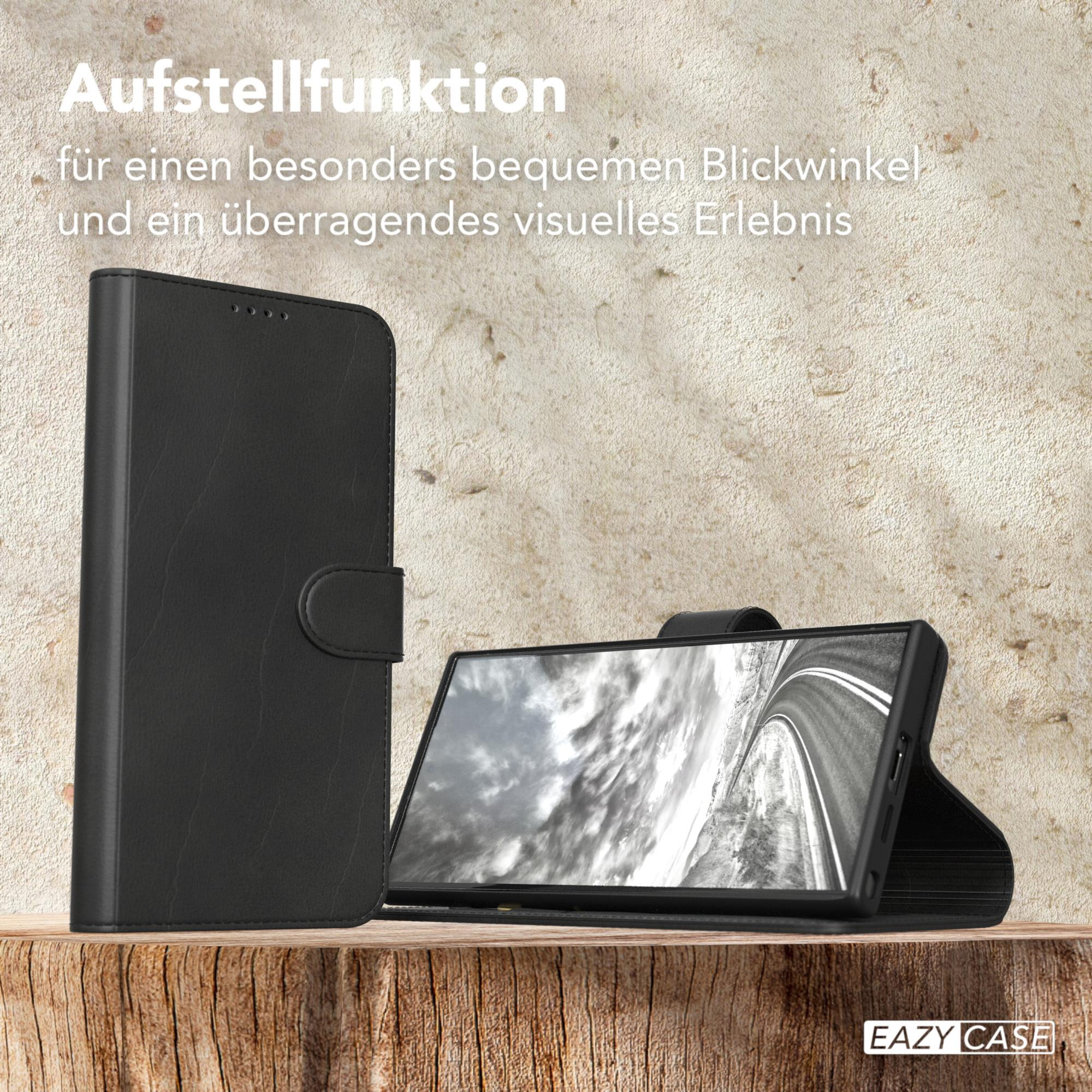 Schwarze Handyhülle mit Telefon darin, offen, Text: 'Eazy Case'.