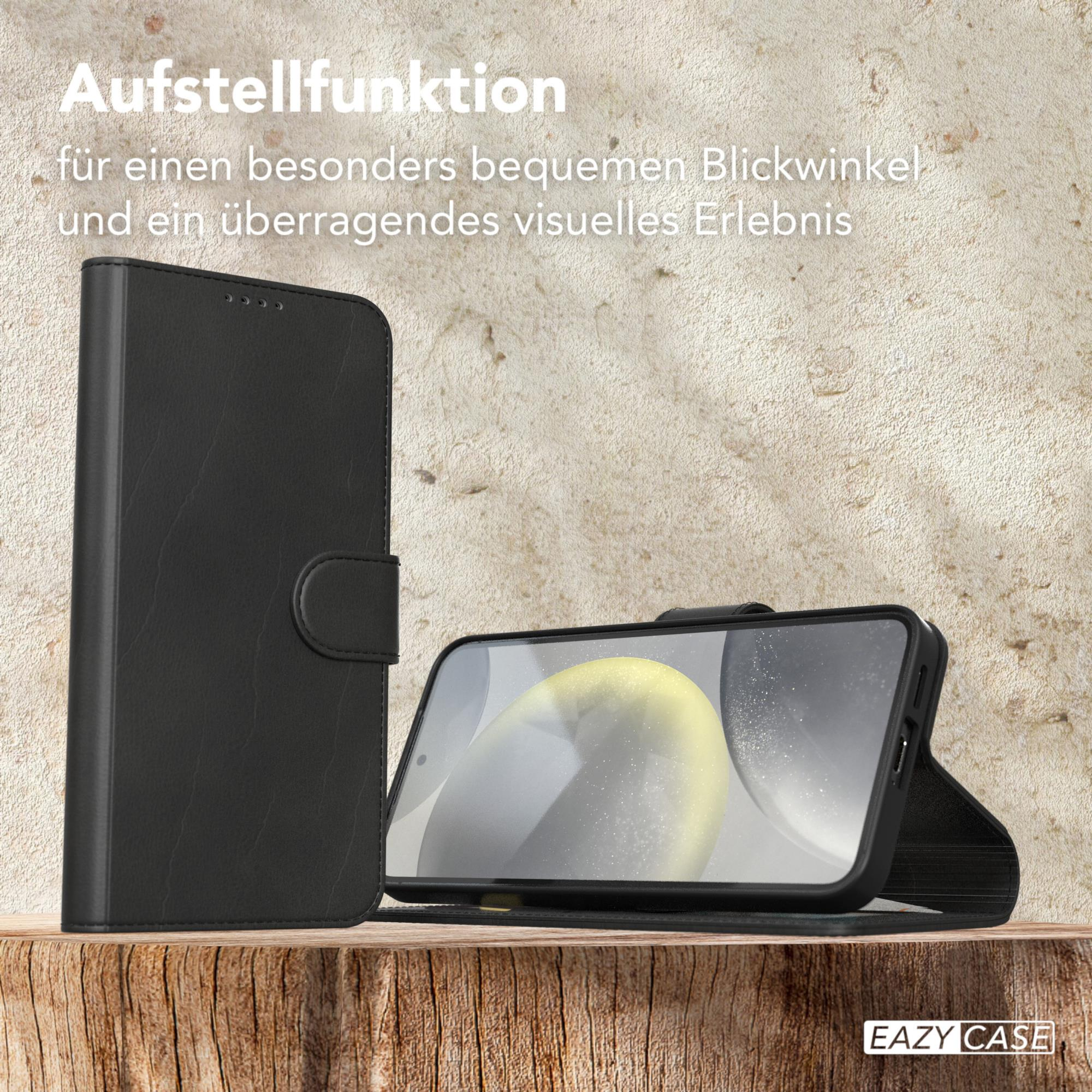 Schwarze Handyhülle und Telefon. Telefon ist hochgestellt. Holzoberfläche.