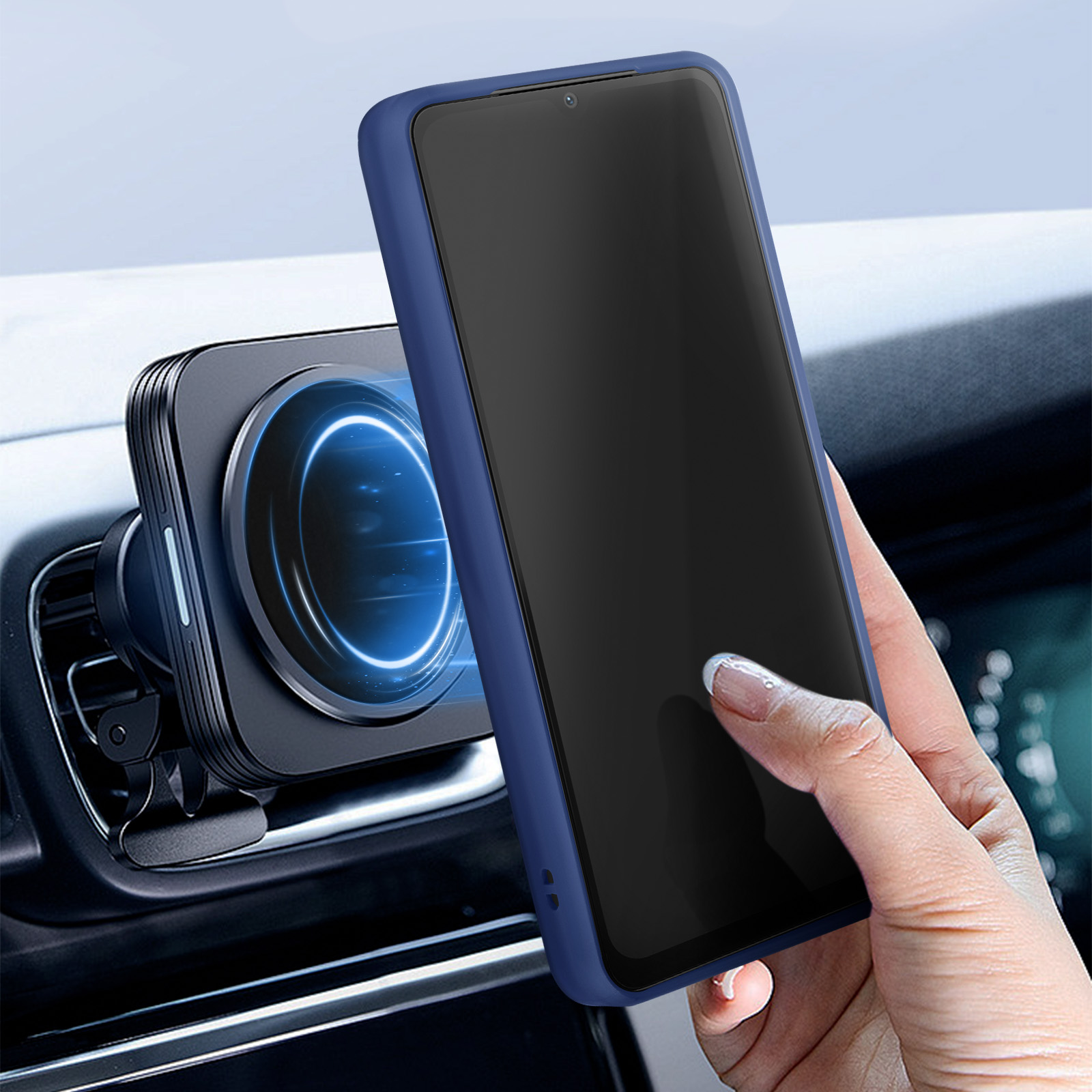 Una mano che tiene un telefono blu accanto a un supporto per telefono per auto con un disco magnetico.