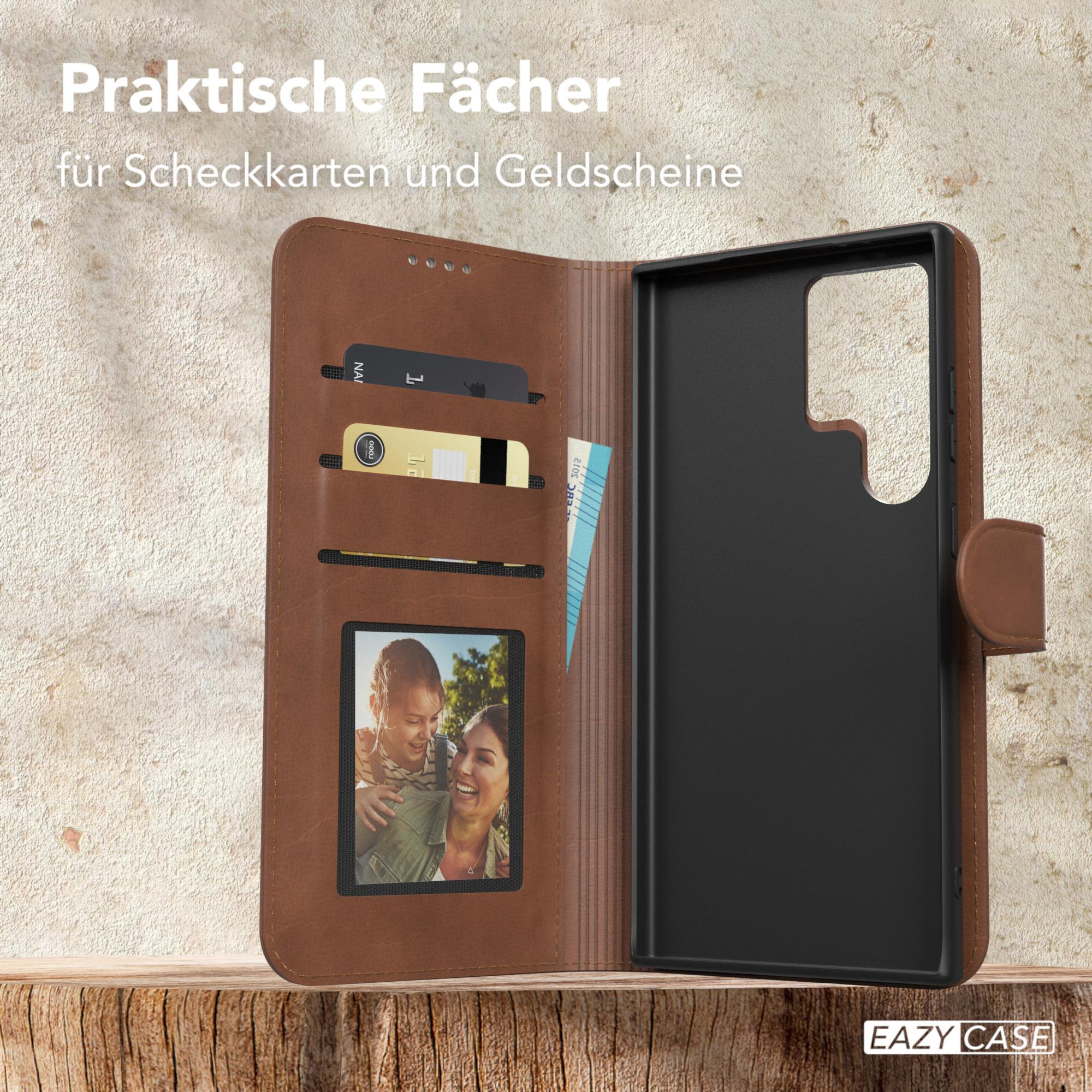 Braune Brieftaschen-Handyhülle mit Fächern und Foto. Der Text 'EAZY CASE' ist sichtbar.