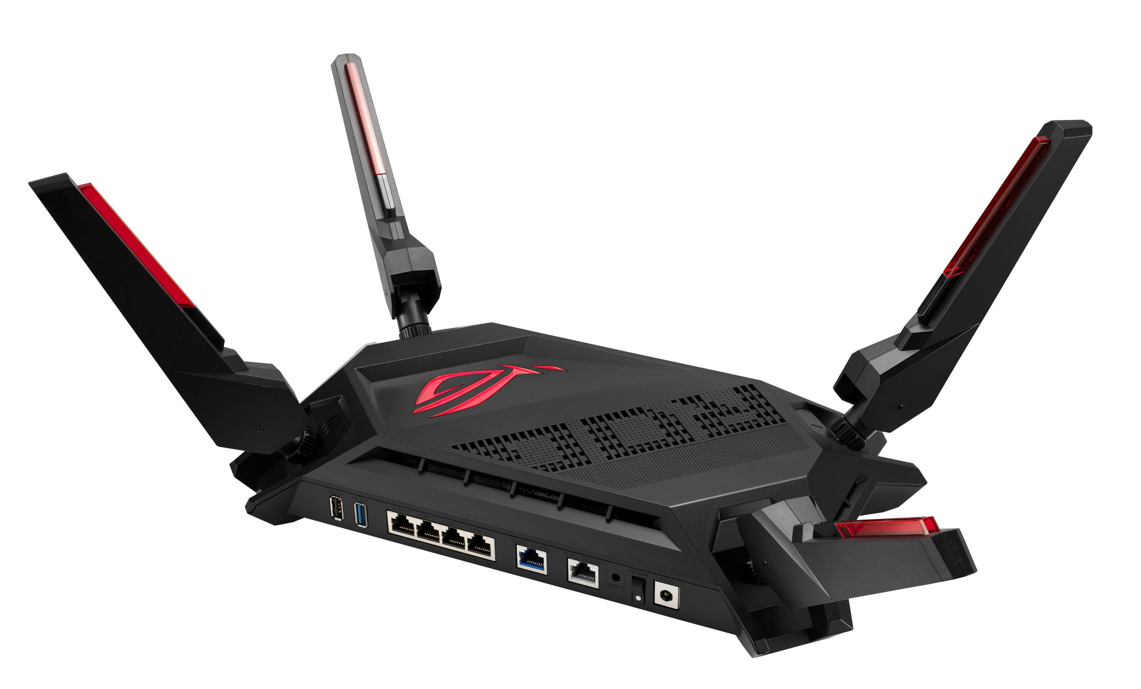 Czarny router z czerwonymi akcentami i antenami, widok z perspektywy na białym tle.