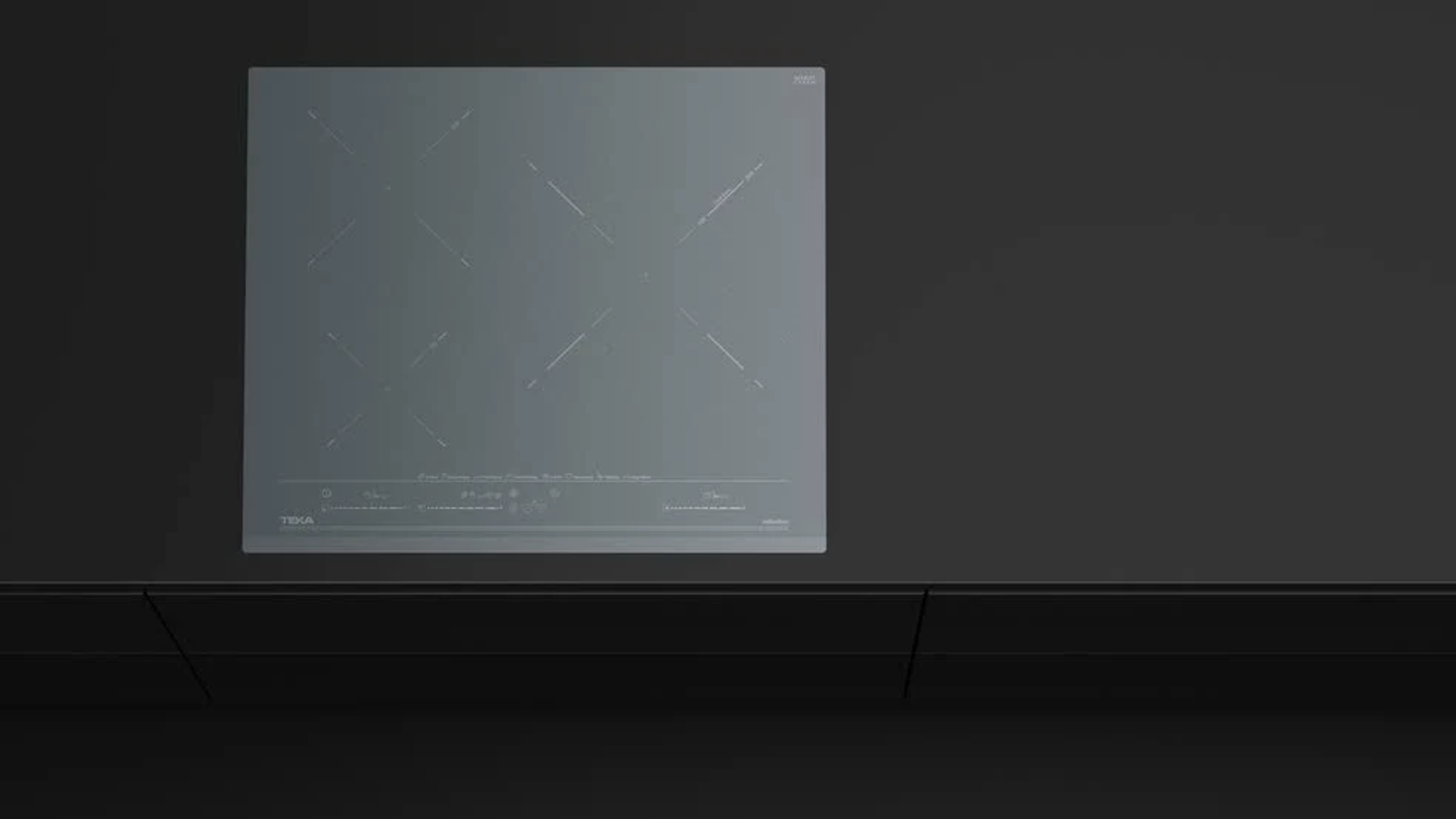 Czarna płyta indukcyjna z czarnym tłem.