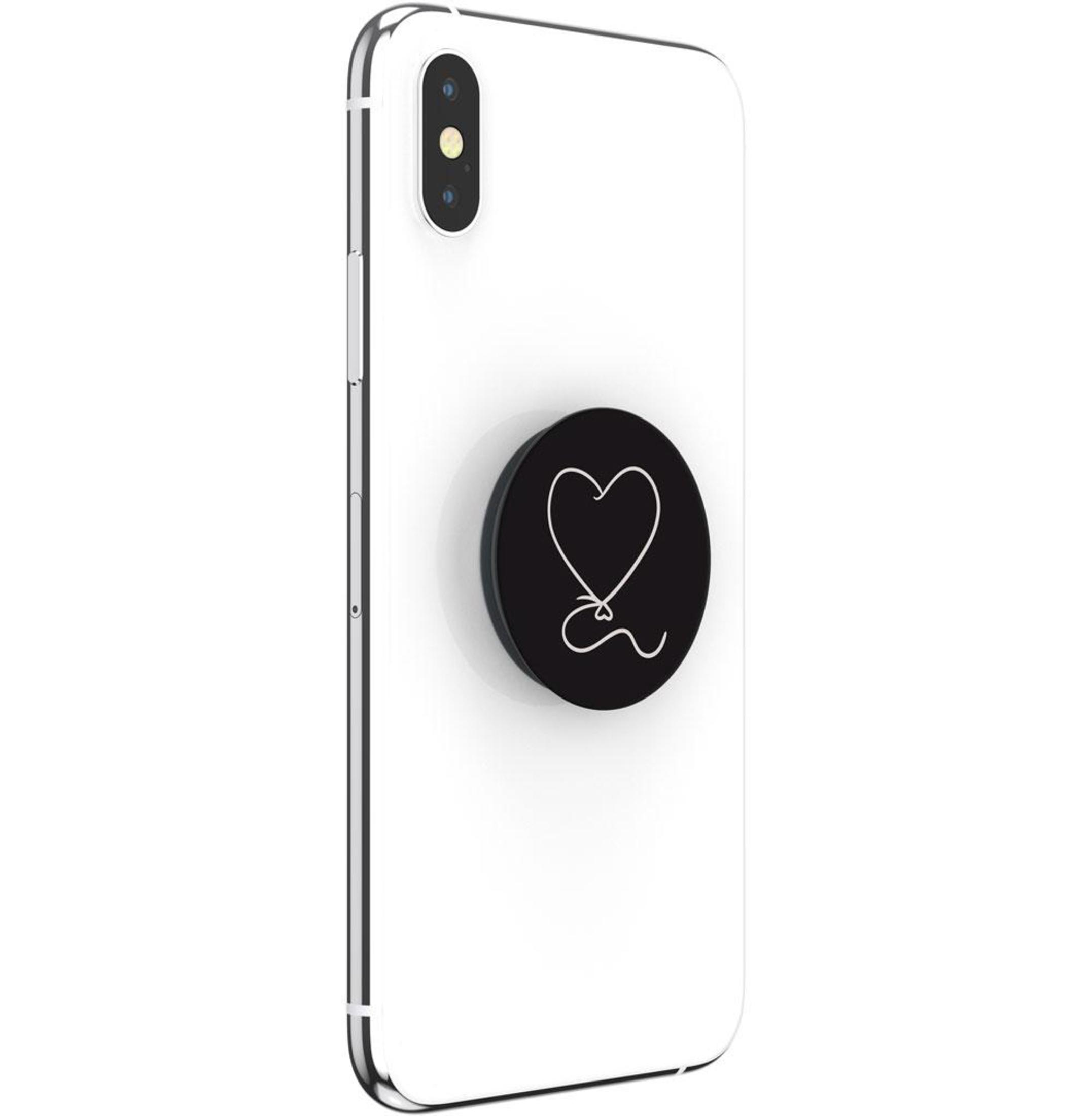 Weißes Telefon mit einem schwarzen PopSocket. Der PopSocket hat ein Herzdesign.