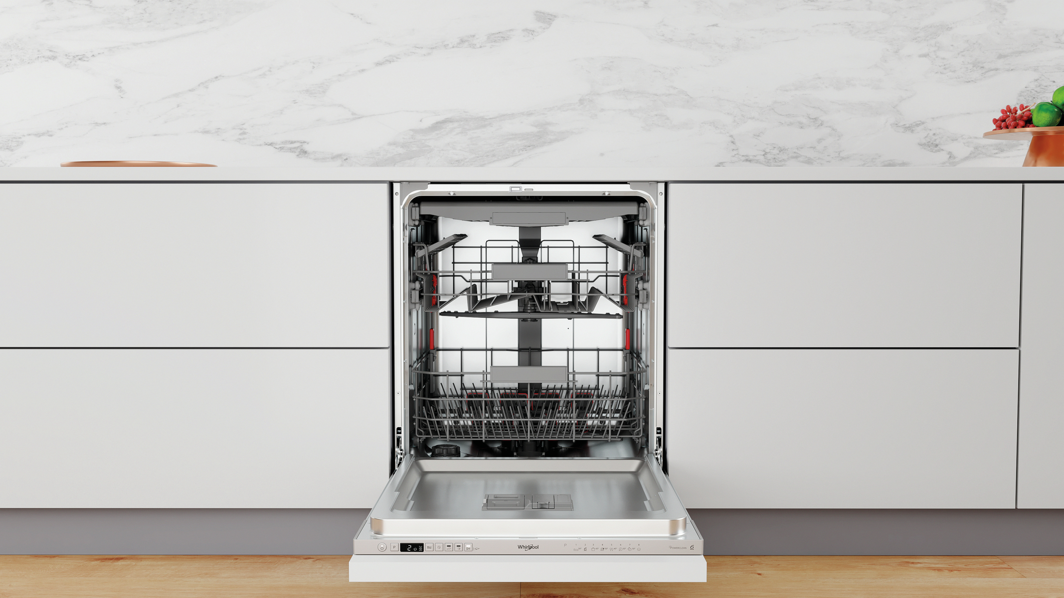 A dishwasher with the door open, showing the racks and interior. White kitchen cabinets.