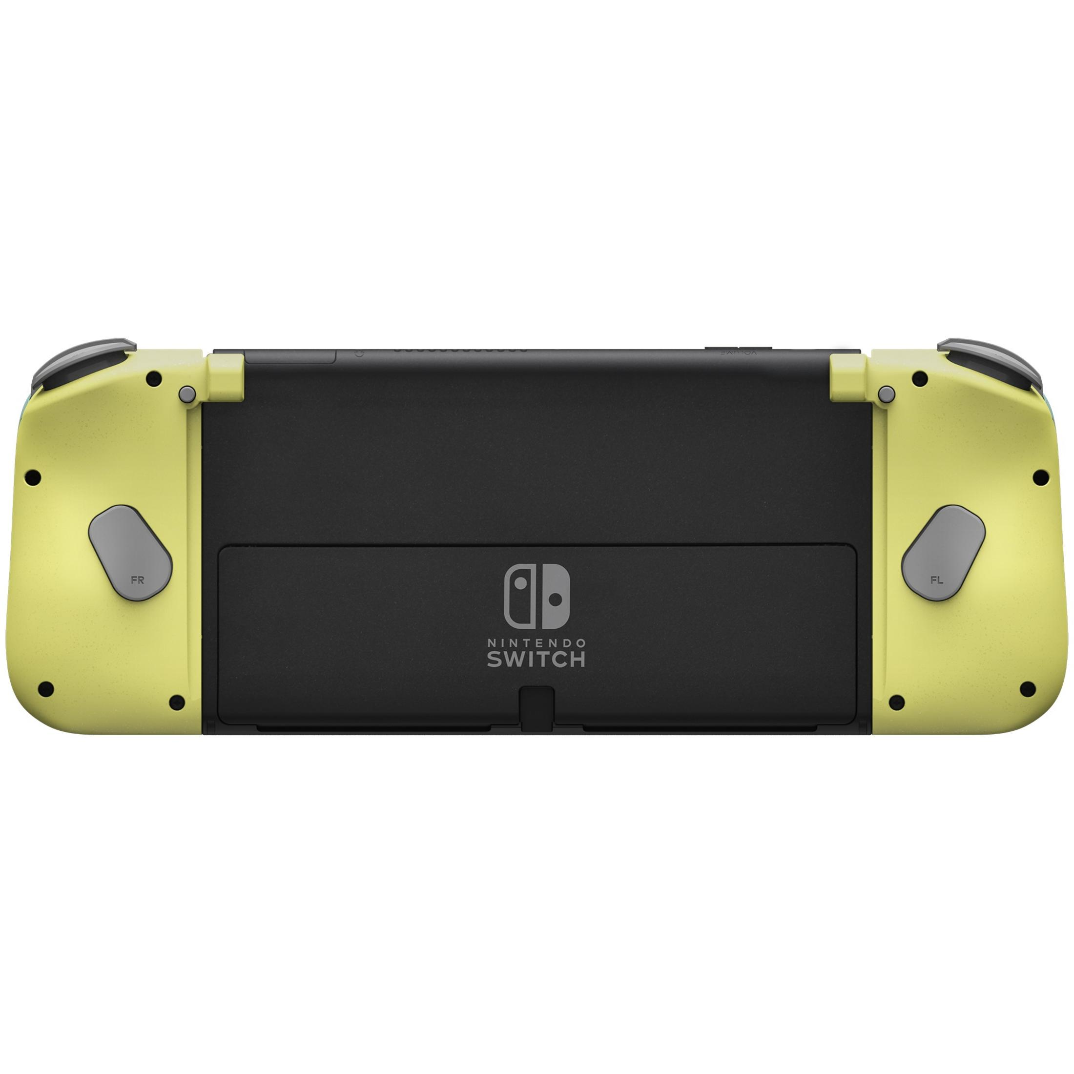 Consola Nintendo Switch amarilla y negra con mandos adjuntos, sobre blanco.