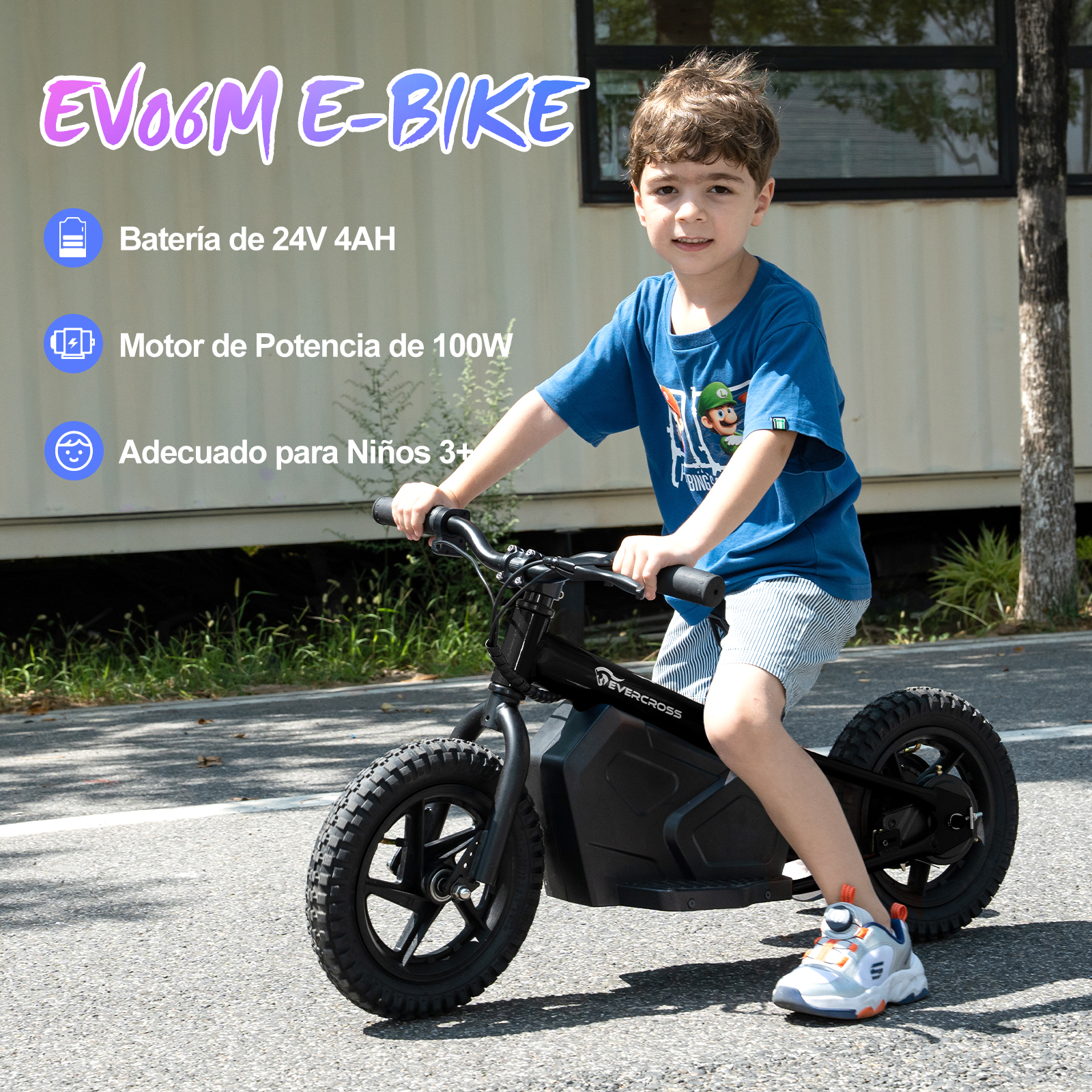 Un niño montando una bicicleta eléctrica negra en una carretera.