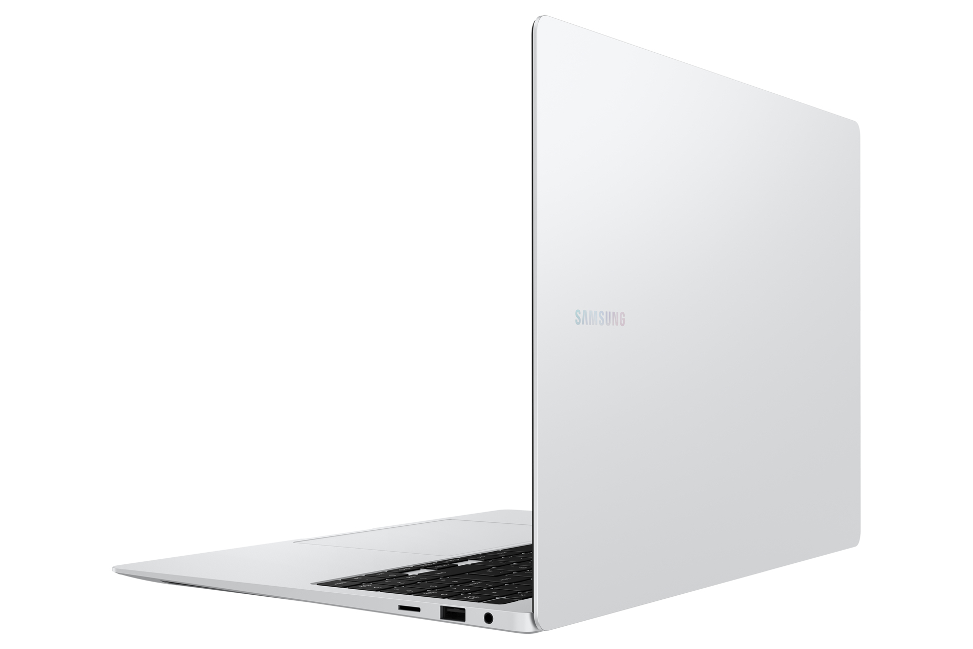Biały laptop na białej powierzchni. Logo Samsung na ekranie.